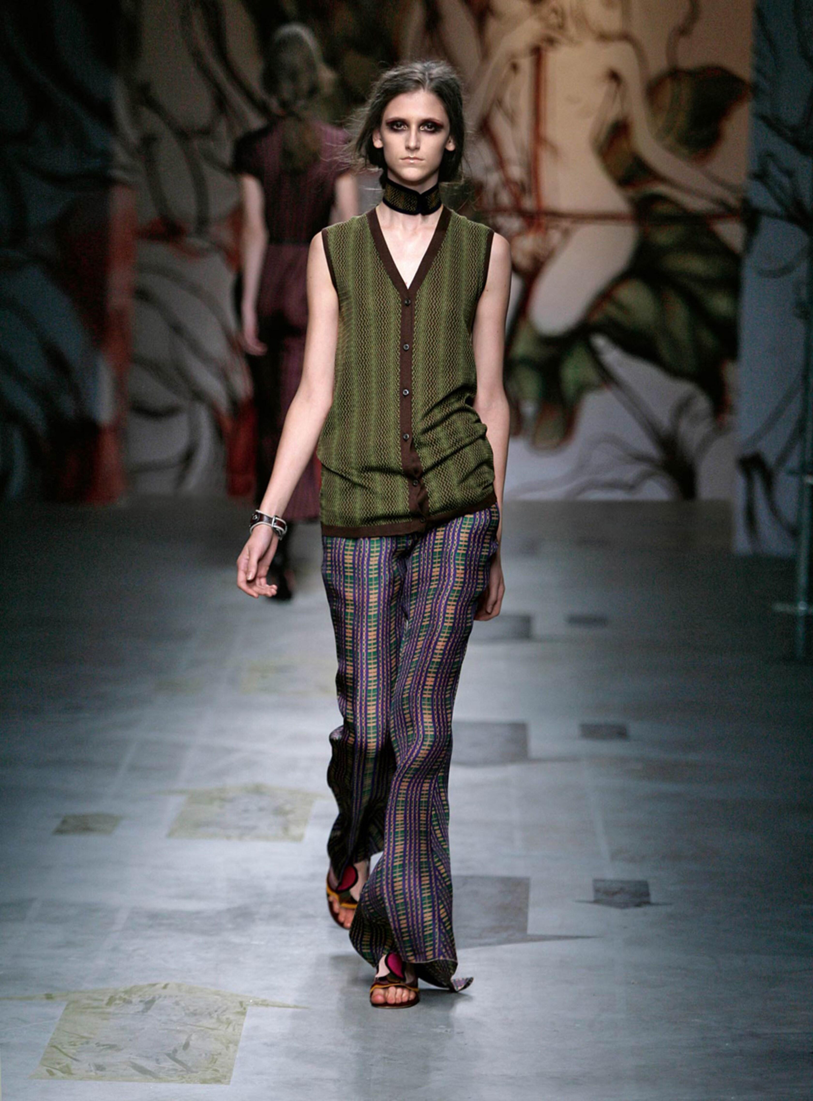 For Prada's Spring/Summer 2008 collection, Miuccia Prada collaborated with Taiwanese-American artist James Jean to create a whimsical, Art Nouveau-inspired collection featuring fairy tale-like prints, resulting in one of Prada's most magical and