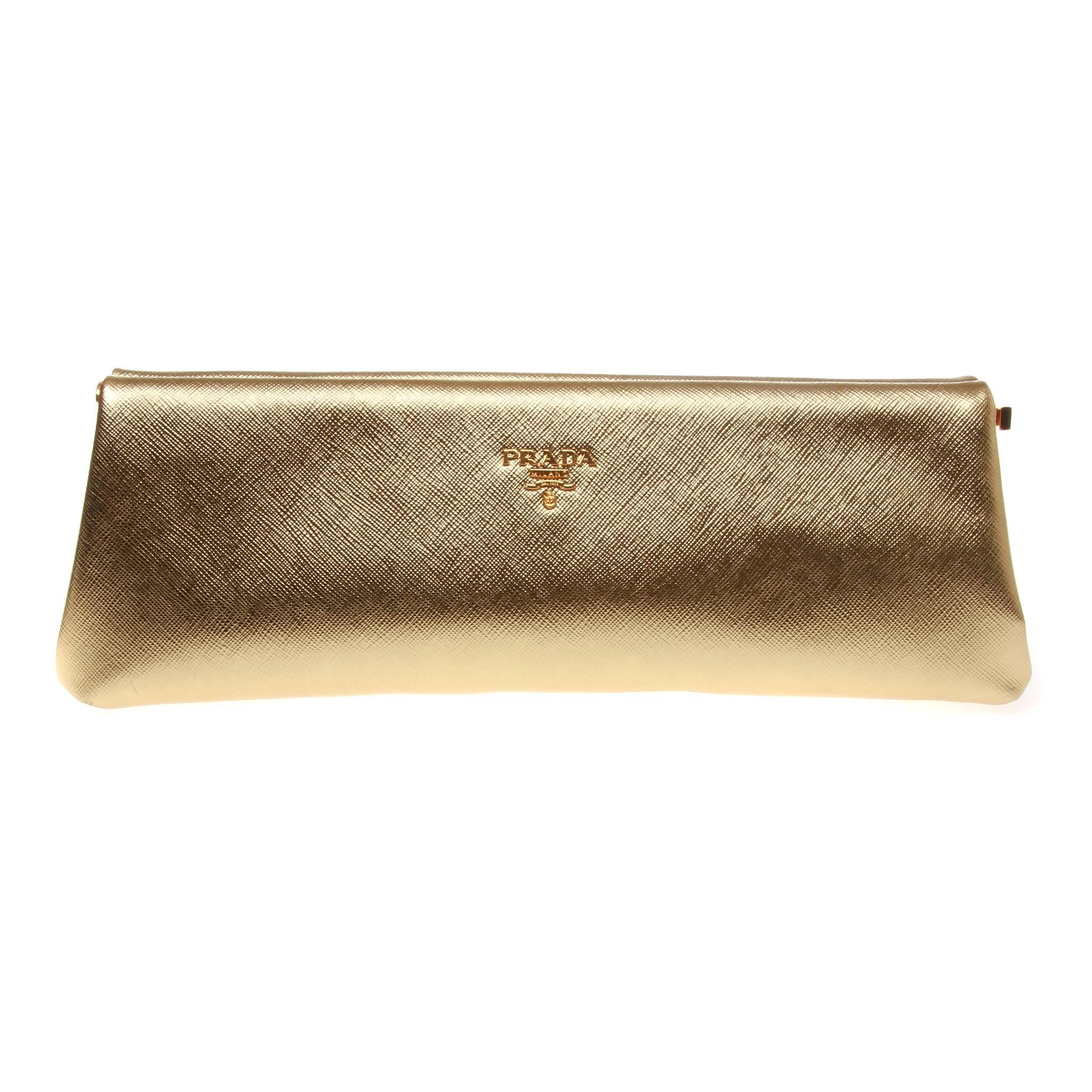 Gold metallic saffiano lux leather Prada frame clutch with gold-tone hardware, beige leather lining, single interior slit pocket and push-lock closure at side. 

Comes with dust bag and authenticity card. 