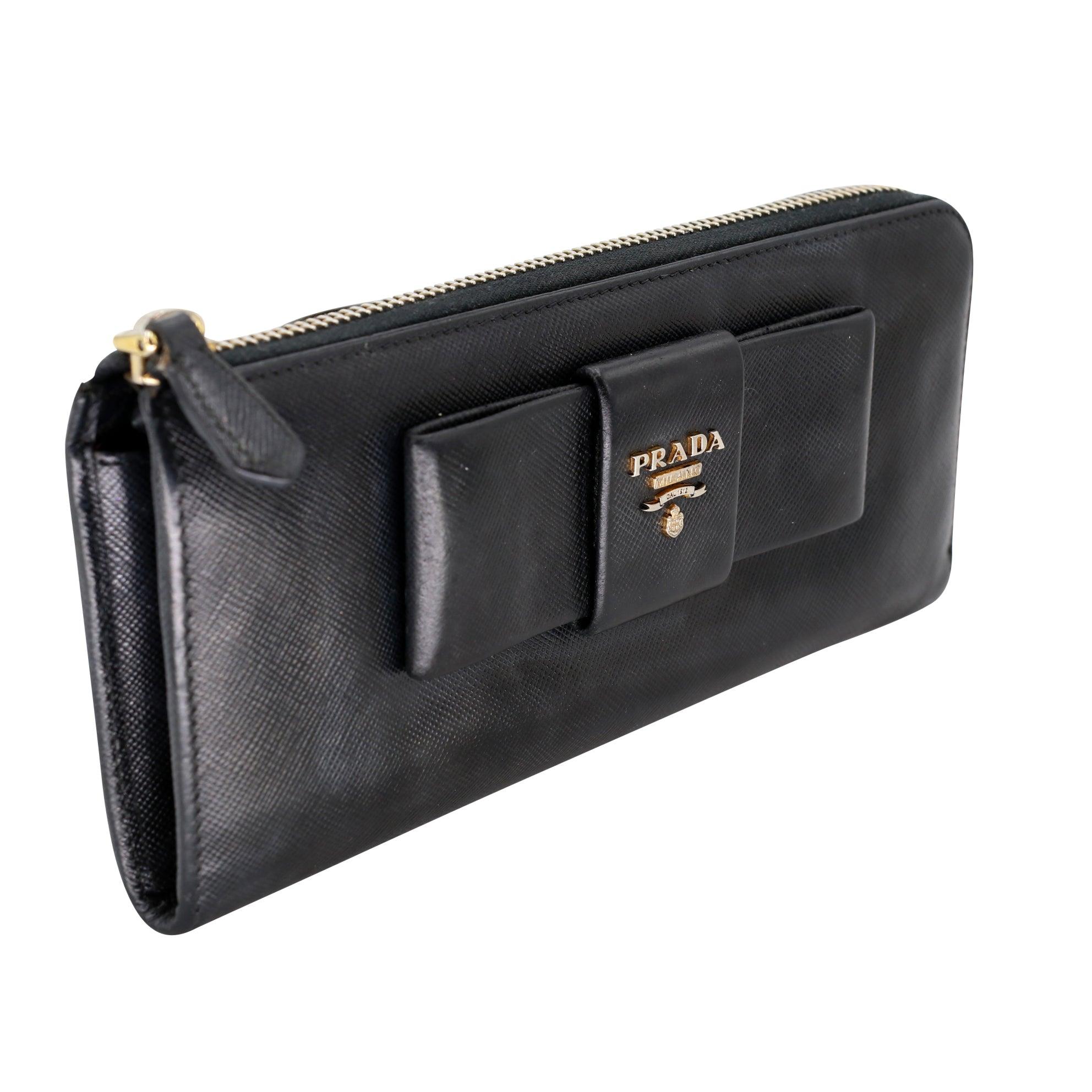 This pre-loved Prada wallet is a great addition to any purse or collection! The saffiano leather is durable and beautiful, and the gold-tone hardware adds a touch of luxury. The full zip around closure keeps everything secure, provides plenty of