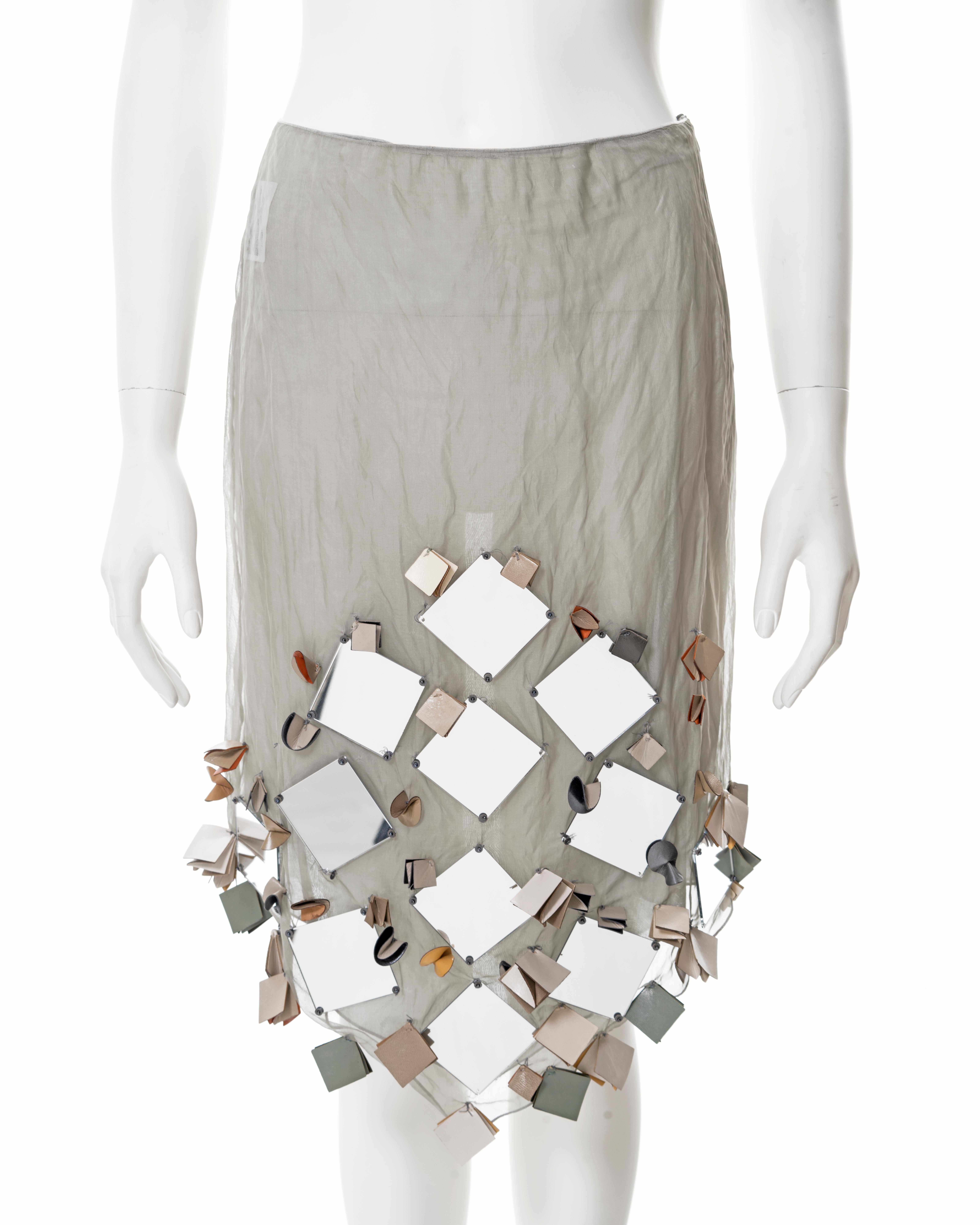▪ Prada embellished skirt 
▪ Creative Director: Miuccia Prada
▪ Sold by One of a Kind Archive
▪ Spring-Summer 1999
▪ Constructed from sage crinkled silk lamé
▪ Sold with an optional cotton underskirt 
▪ Large square mirror and leather adornments 
▪