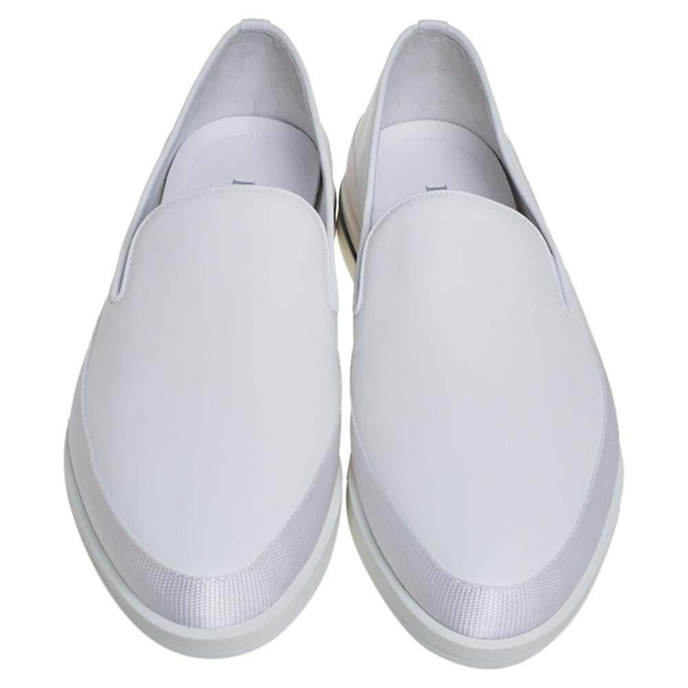 Designed to elevate your style quotient and give you comfort at the same time, Prada brings you these lovely slip-on sneakers. They've been crafted from quality leather and designed with almond toes and textured midsoles that also feature the brand