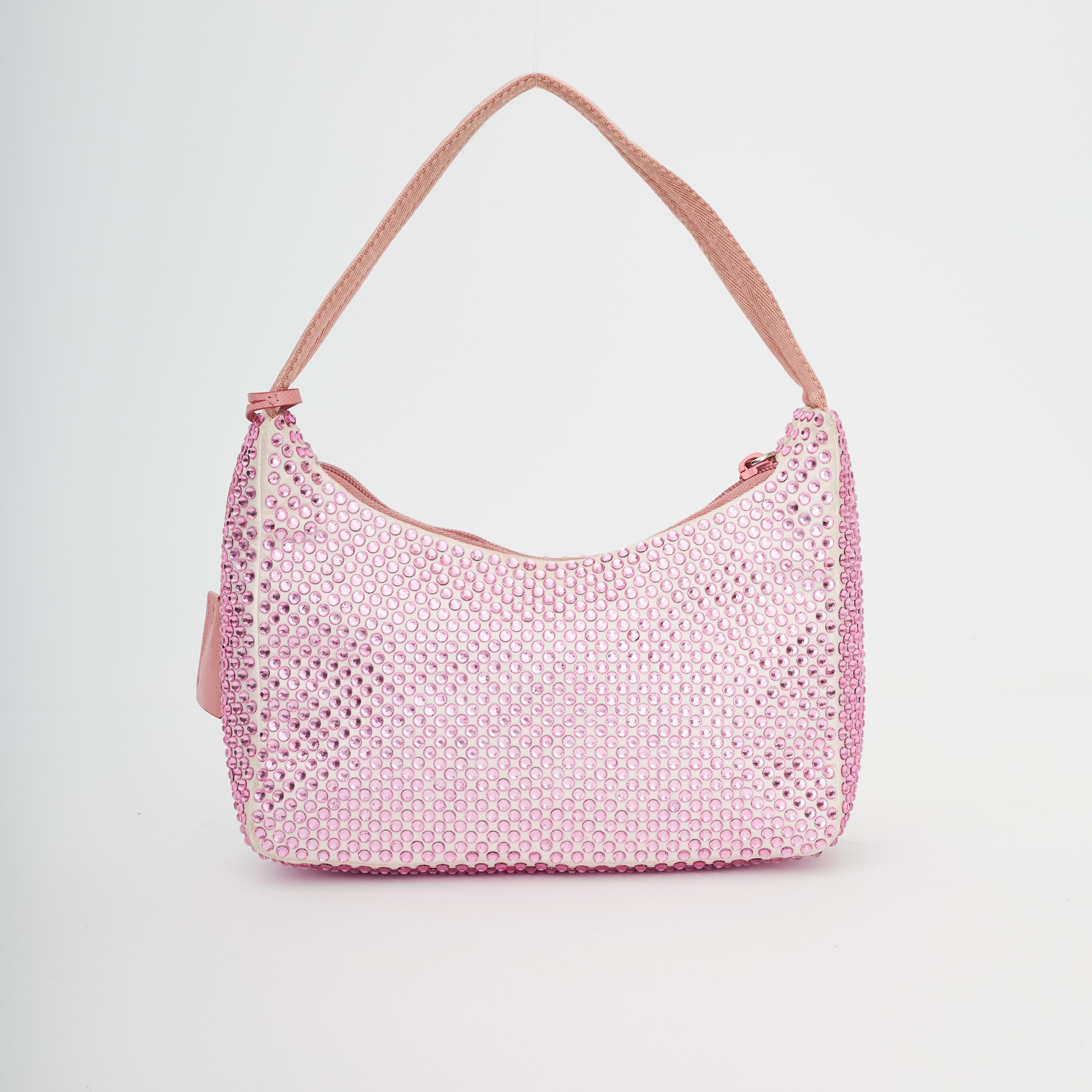 This Prada handbag is made of crystal embellished satin. The bag features a nylon shoulder strap and the top zipper opens to a matching fabric interior. Miami exclusive bought from the design district. Rosttea. Work with Miami artist.

COLOR:
