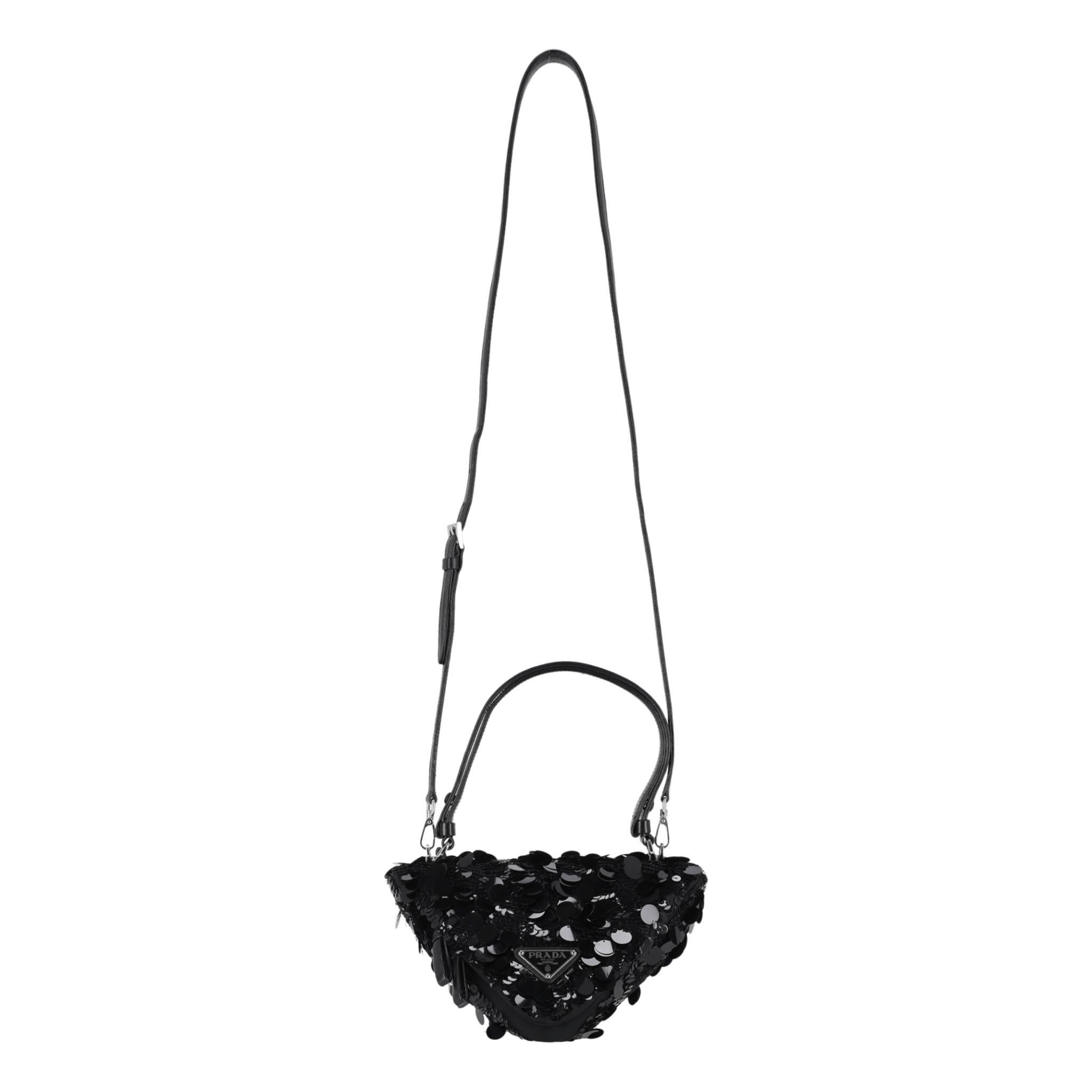 Prada Sequin Embellished Triangle Leather Bag

Black shoulder/crossbody bag in the brand's signature triangle shape, crafted from leather and fully embellished with multi-sized sequins.

Featuring dual leather top handle and detachable, adjustable
