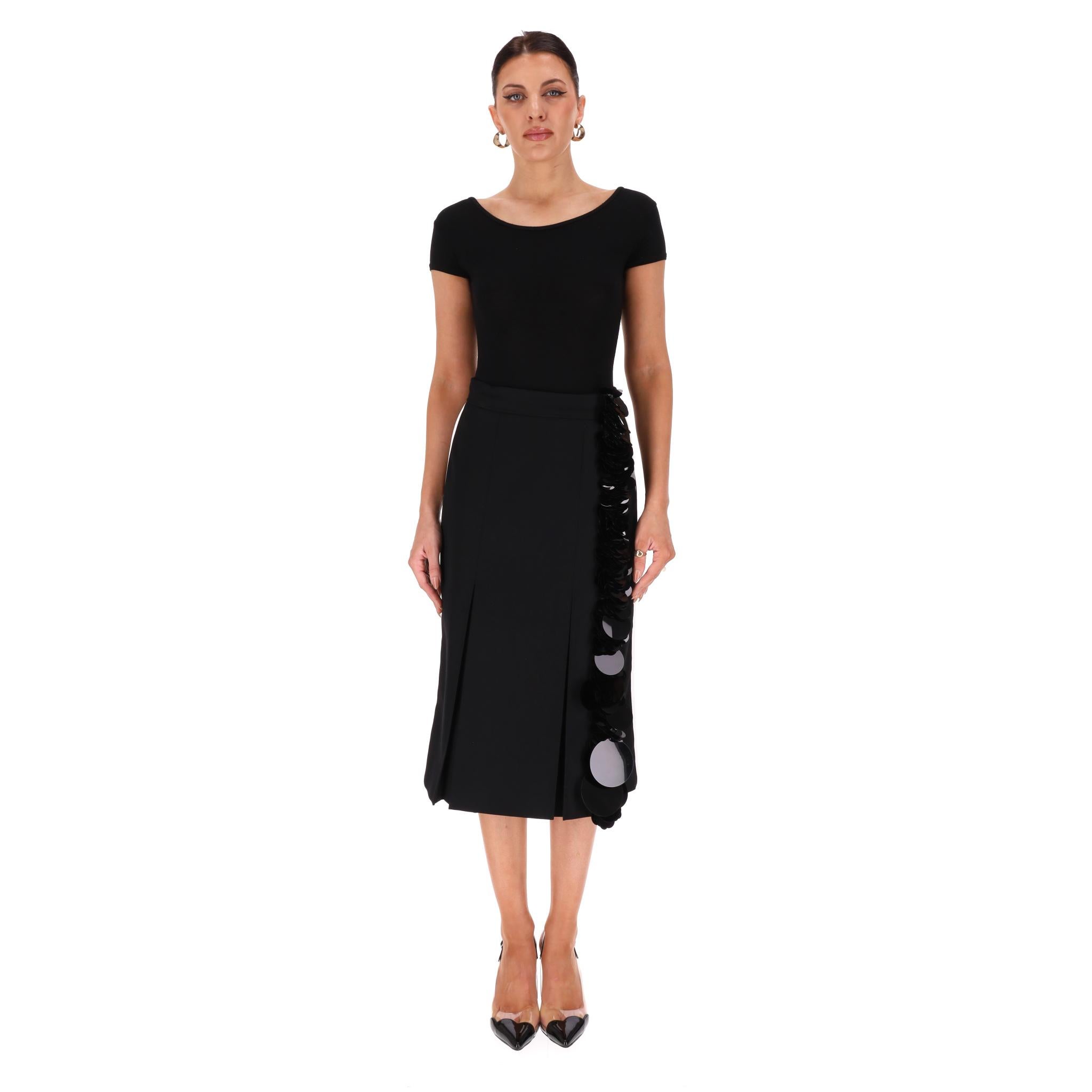 Prada Sequin Trimmed Virgin Wool Midi Skirt

Black midi skirt fully crafted from virgin wool and adorned with tonal sequin trim in varying sizes.

Featuring pleat-detail to the front, slit to the back and side zip and bar fastening.

Rrp Approx.