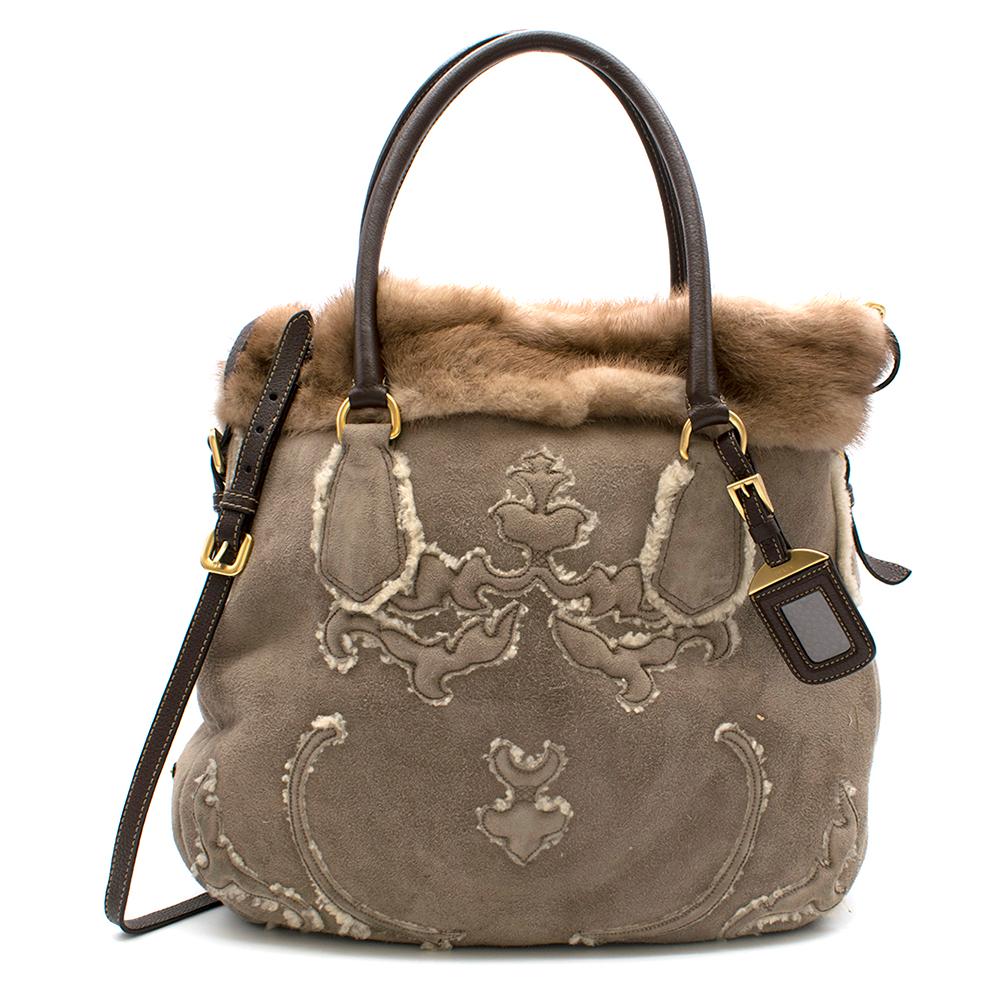Prada Sheep Shearling & Suede Mink Fur Trim Tote Bag

Crafted with distressed leather
Soft Mink fur trim 
Suede exterior 
Leather handles and shoulder strap
Magnetic snap closure 
Interior lining: shearling
Goldtone hardware on the tote


Please