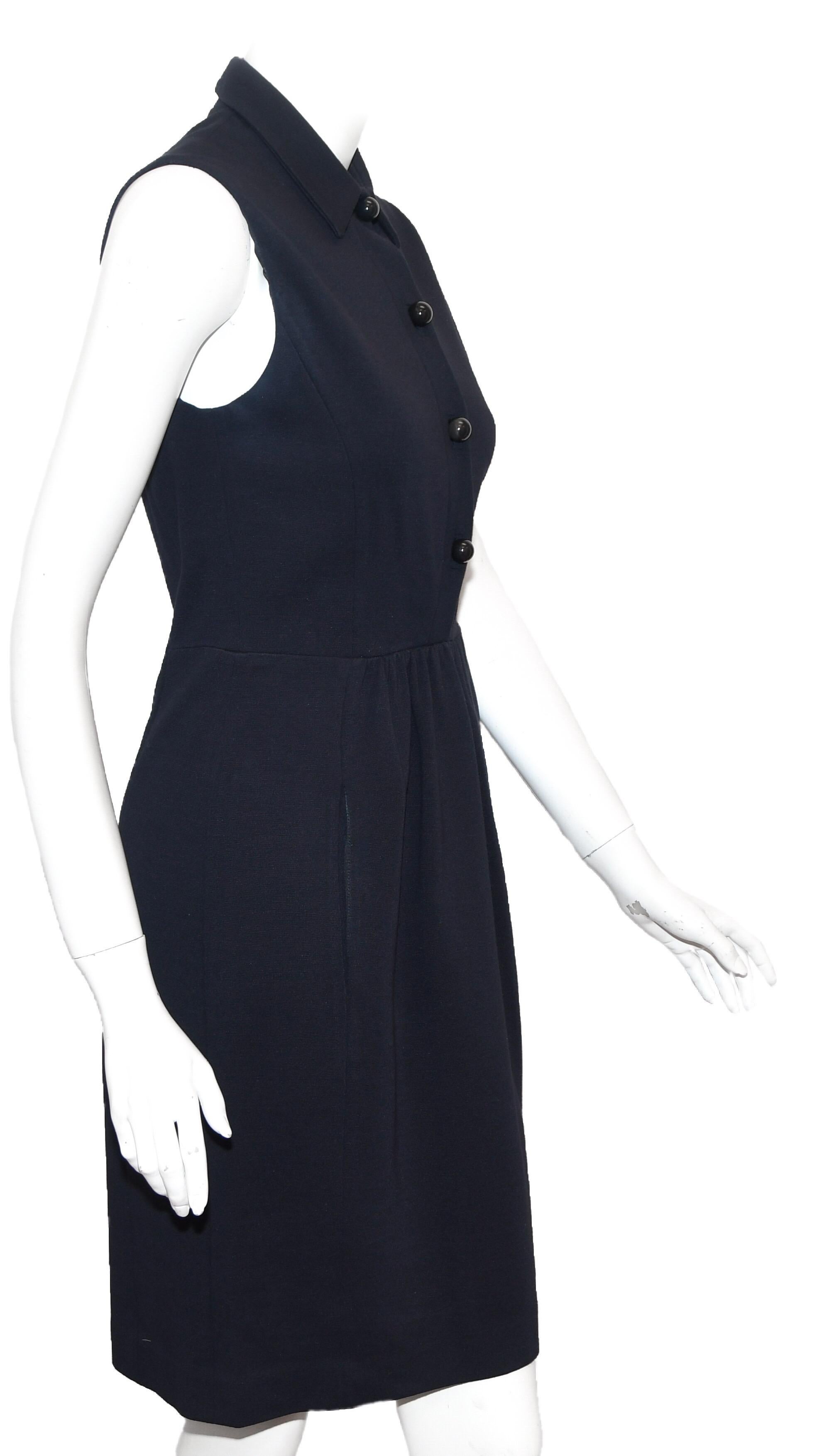 Prada shirt collar navy blue dress is gathered at the waist and has a shirt collar.  This is a casual and transitional dress that can go from summer to fall by just adding a jacket or sweater.  5 buttons for front closure.  Bodice is lined. 