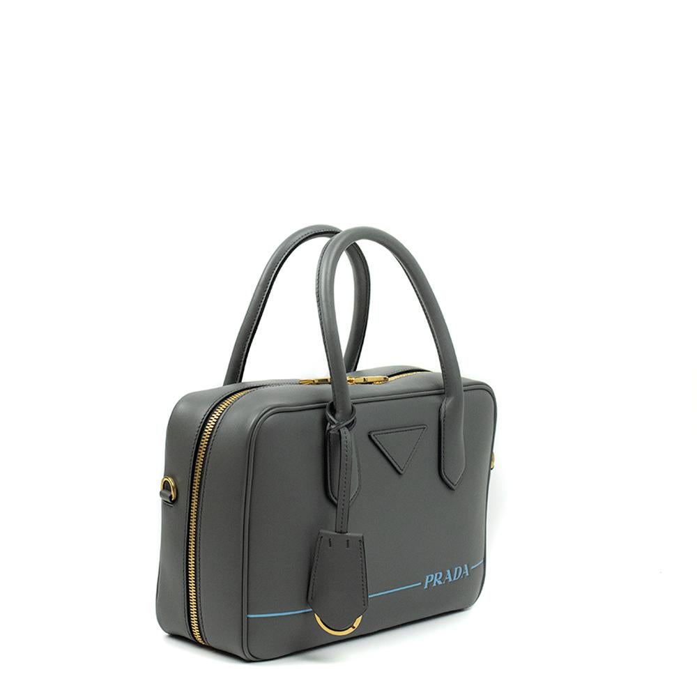 - Designer: PRADA
- Condition: Never worn. 
- Accessories: Dustbag
- Measurements: Width: 26cm, Height: 17.5cm, Depth: 8.5cm, Strap: 106cm
- Exterior Material: Leather
- Exterior Color: Grey
- Interior Material: Cloth
- Interior Color: Black
-