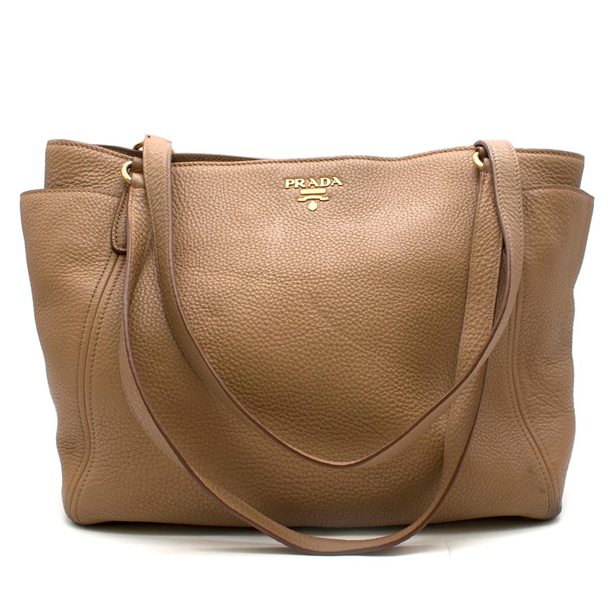 Prada Side Pocket Zip Vitello Daino

- Light Brown soft leather tote bag 
- Slouchy style
- Two side and one inside pockets 
- Shoulder strap 
- Dustbag included

Please note, these items are pre-owned and may show some signs of storage, even when