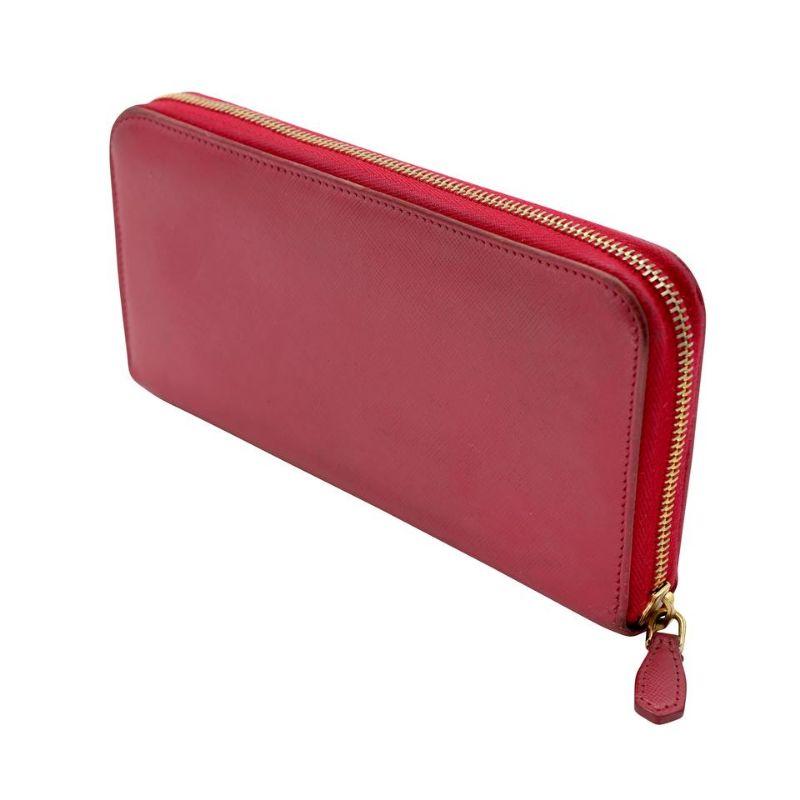 Prada Signature Saffiano Trend Leather Zip Wallet PR-W1217p-0006

This cute and sophisticated Prada Fragola/Talco Saffiano Trend Metal Leather Zip Wallet features a durable Saffiano leather and gold-tone hardware accents with a zip around closure.