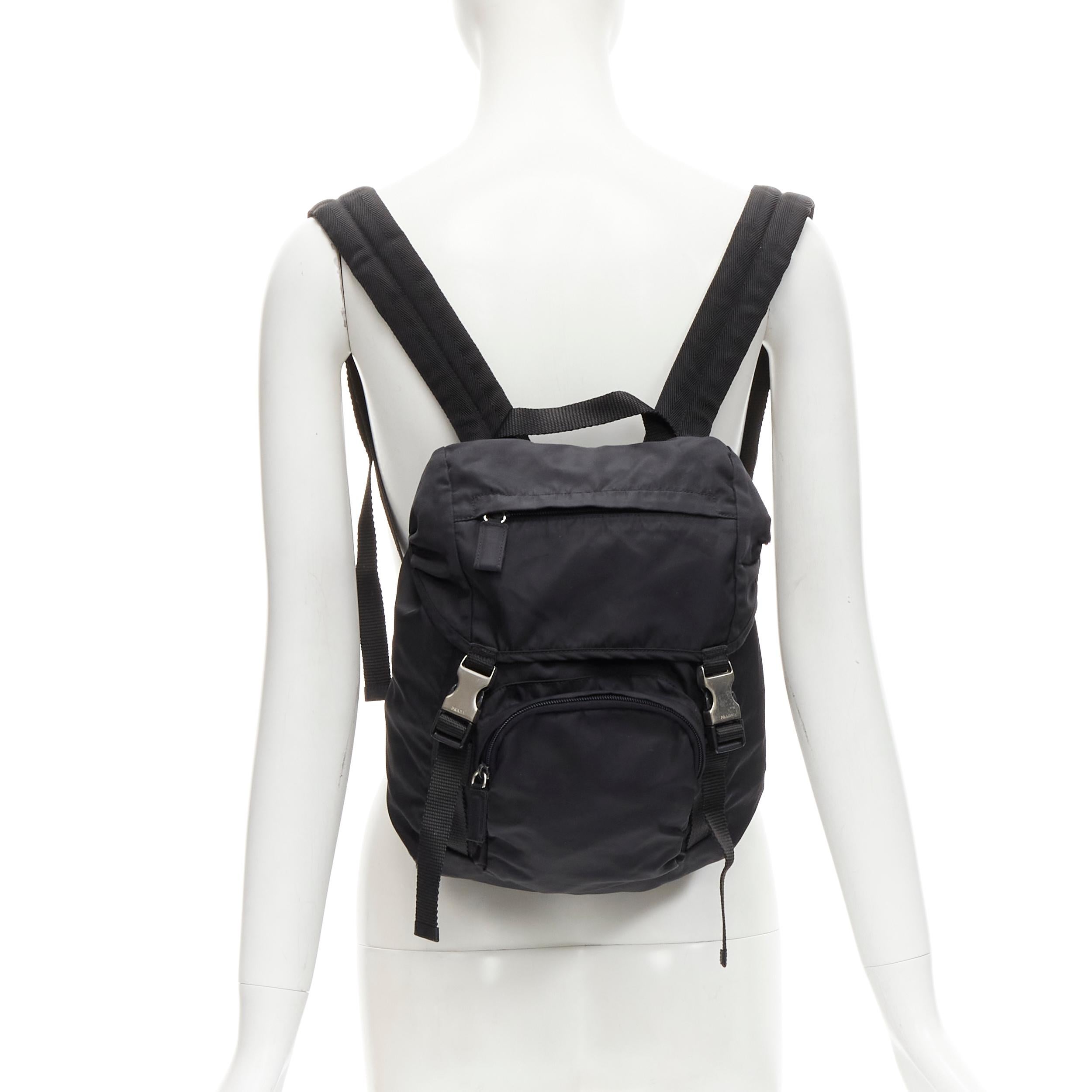 PRADA Signature Tessuto Nylon black triangle logo double buckle small backpack
Reference: TGAS/C01734
Brand: Prada
Designer: Miuccia Prada
Material: Nylon
Color: Black
Pattern: Solid
Closure: Drawstring
Extra Details: Drawstring closure with buckles