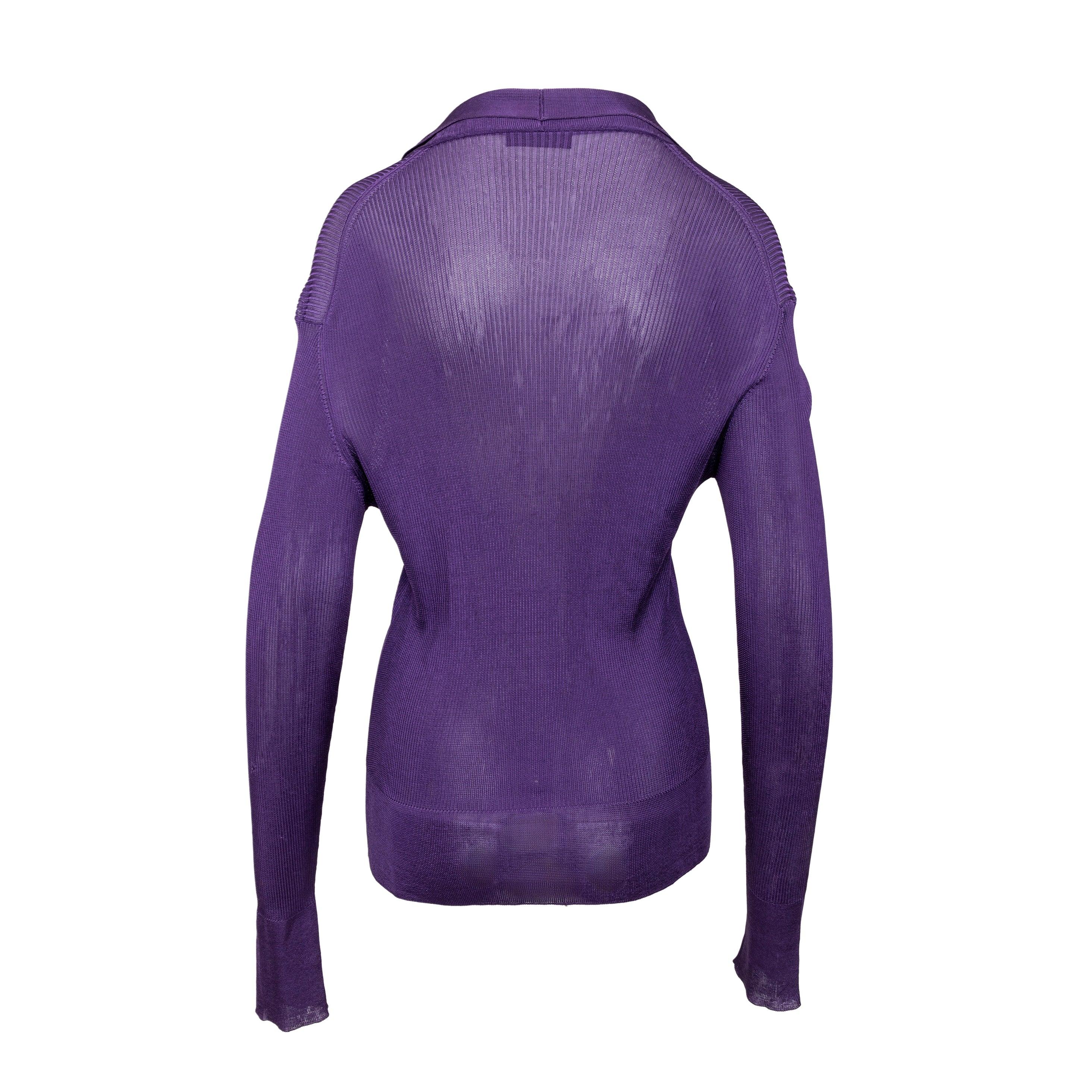 This Prada Silk Ribbed Top is crafted from a luxurious silk blend ribbed fabric in a vivid purple color. Combining comfort and style, the relaxed collar, front buttons, and ribbed hem add elegant details to the long-sleeve cardigan top.
Remarks: The