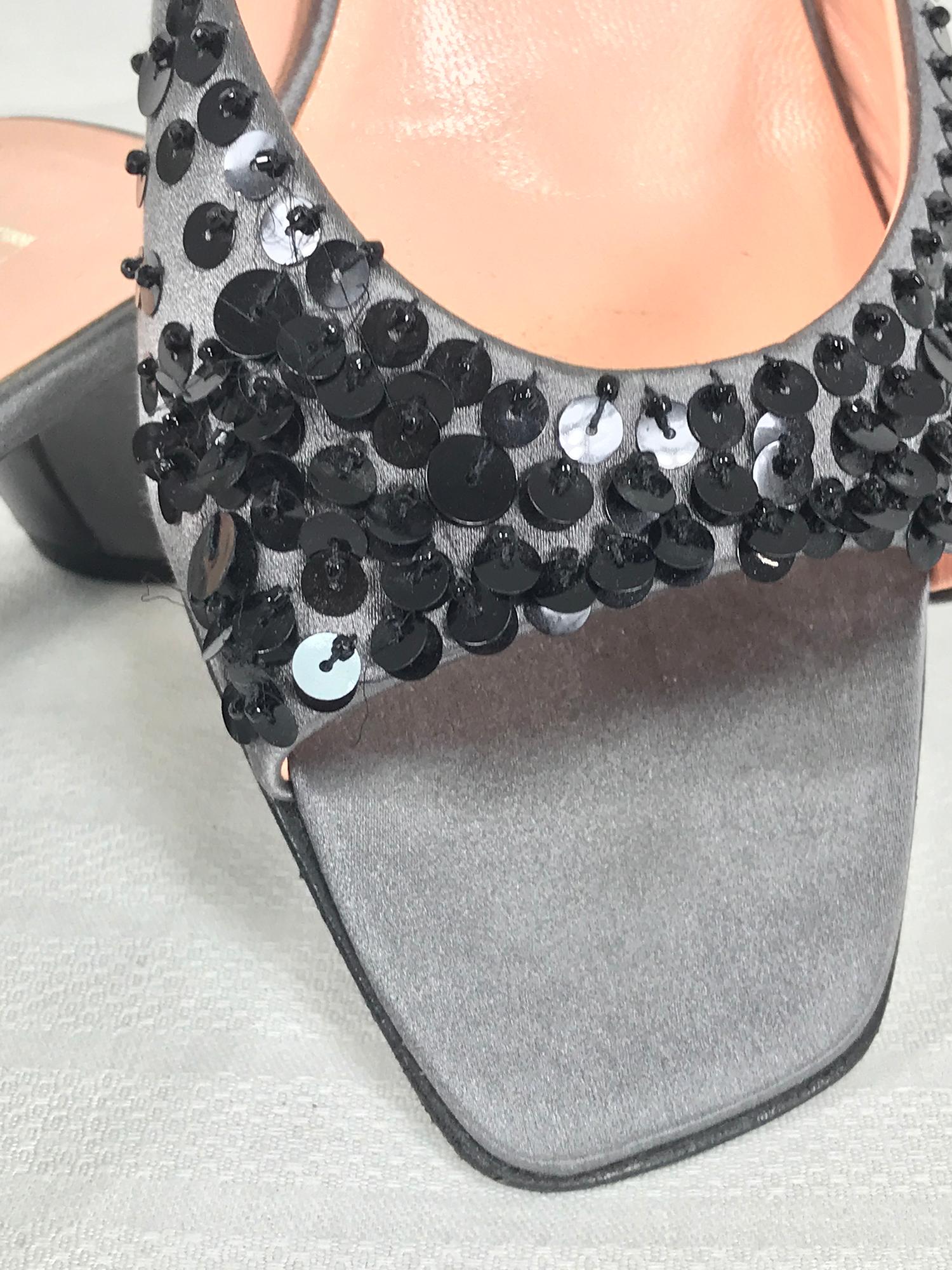 Prada silver satin & black sequin open toe under slung heel mules 38. Beautiful shoes barely worn. Silver satin with black sequins sewn on the front. Open toe, curved under slung heels. Lined in pink leather. Black leather soles.