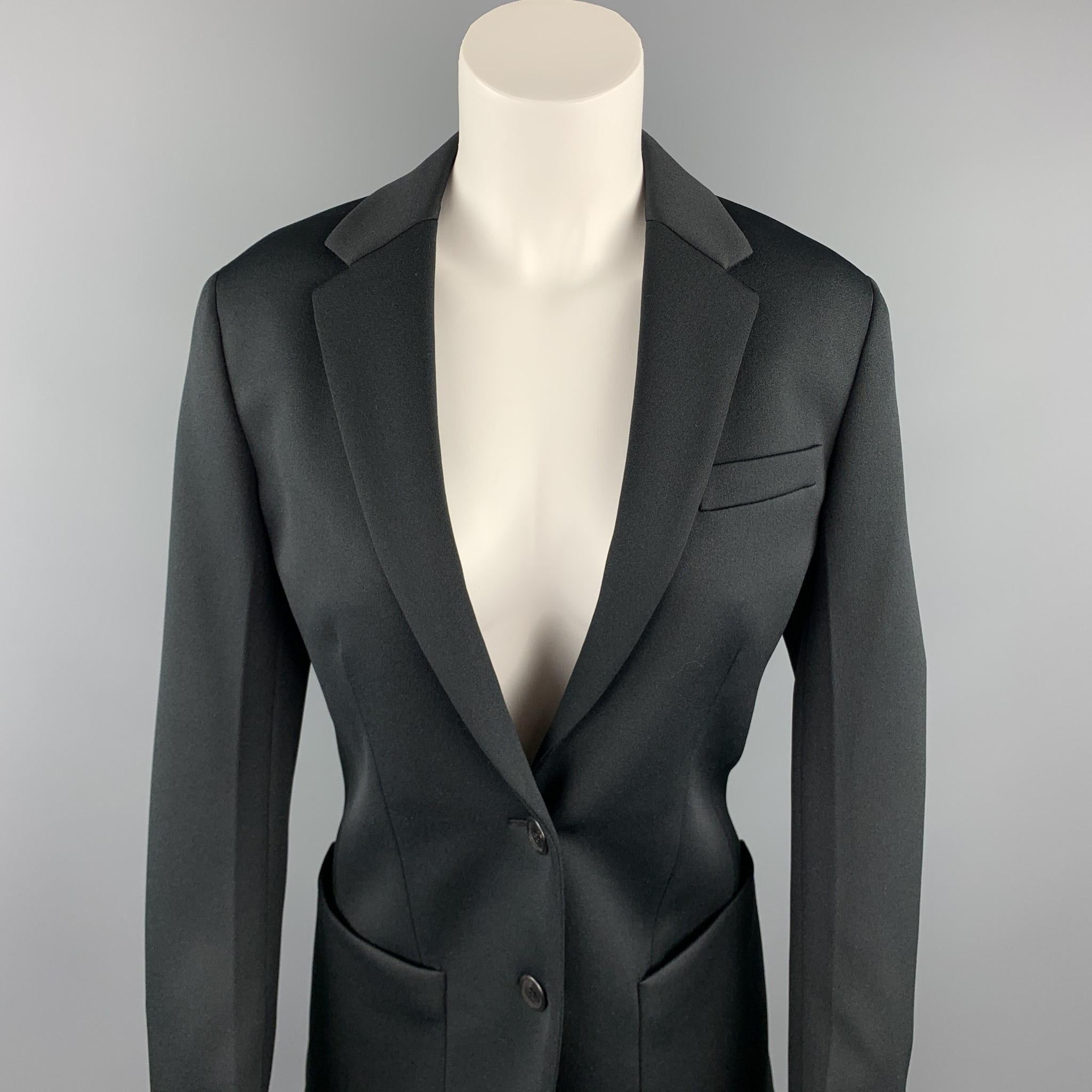 PRADA blazer comes in a black polyester with a full liner featuring a oversized fit, notch lapel, patch pockets, an a two button closure. Made in Italy.

New With Tags.
Marked: IT 36

Measurements:

Shoulder: 15.5 in.
Bust: 36 in. 
Sleeve: 24 in.