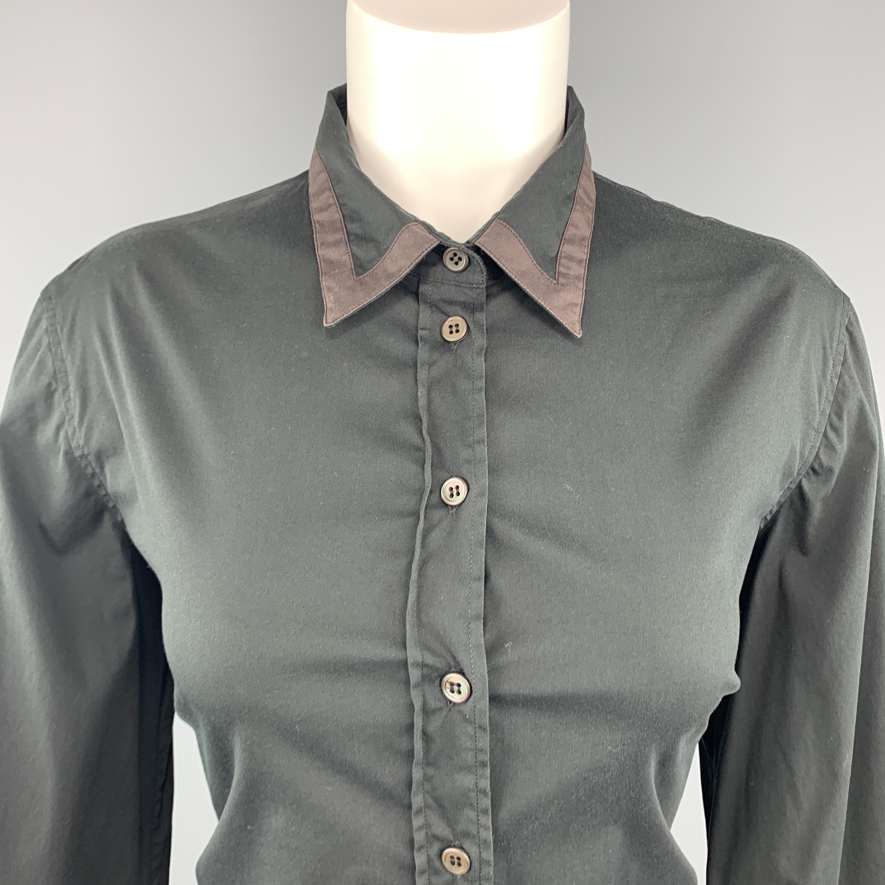 PRADA shirt comes in black stretch cotton with a cropped sleeves and brown trim along collar and cuffs. Made in Italy.
 
Very Good Pre-Owned Condition.
Marked: IT 46
 
Measurements:
 
Shoulder: 17 in.
Bust: 38 in.
Sleeve: 18 in.
Length: 23 in.