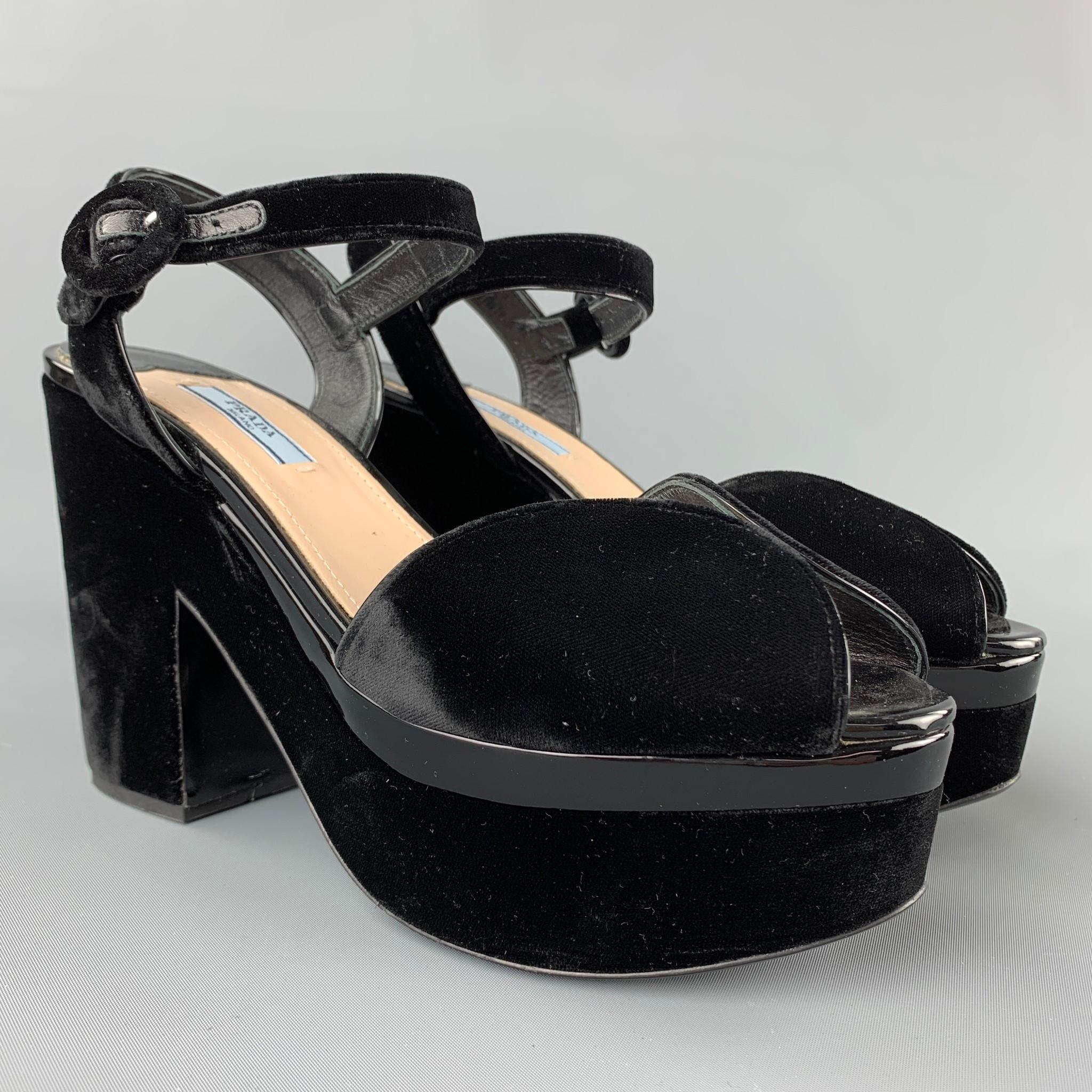 PRADA sandals comes in a black velvet with a patent leather trim featuring a peep toe, platform, and a ankle strap closure. Made in Italy. 

Very Good Pre-Owned Condition.
Marked: EU 40
Original Retail Price: $825.00

Measurements:

Heel: 4.5