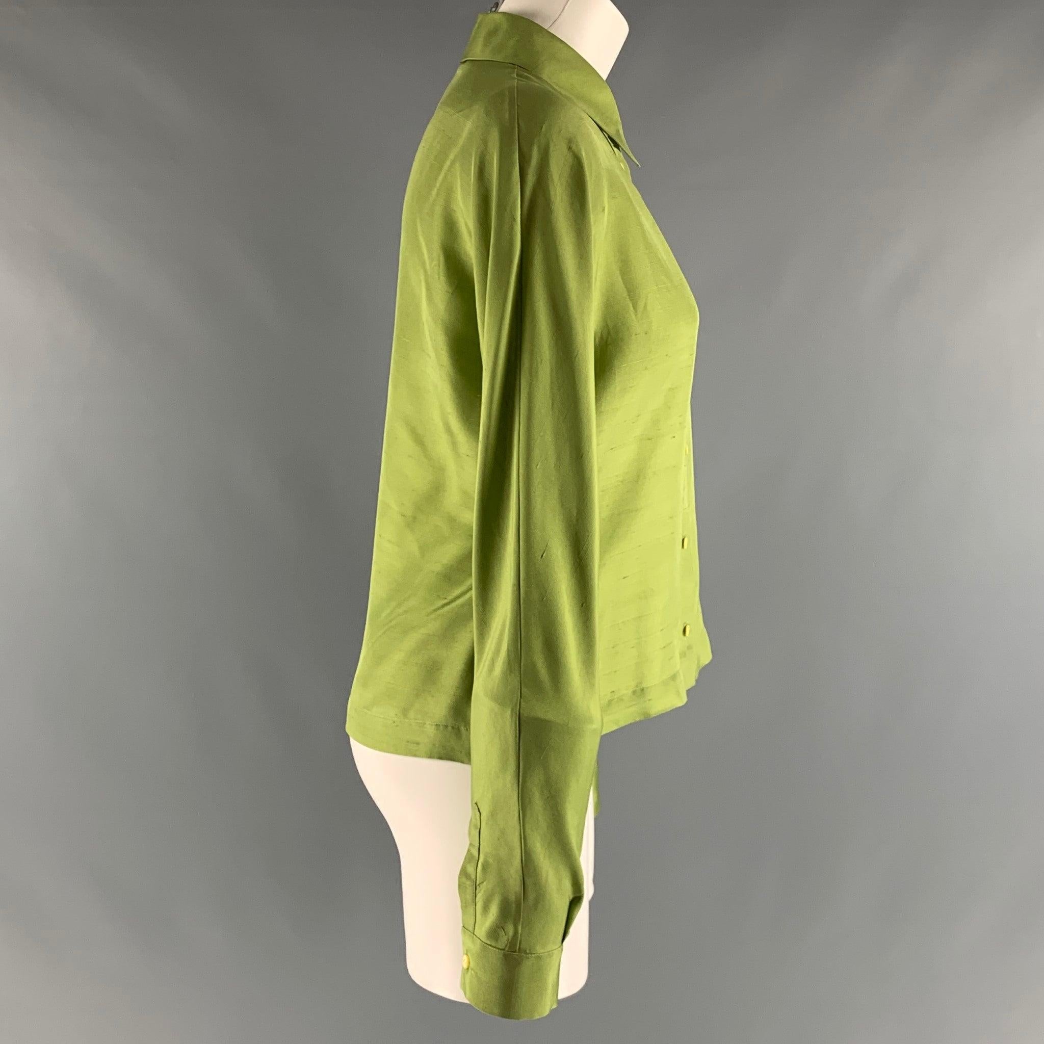 PRADA dress shirt comes in green silk woven material with a spread collar, and button up front. Made in Italy.Good Pre- Owned Conditions. Moderate marks on the left side. As- Is. 

Marked:  IT 46 

Measurements: 
 
Shoulder: 17 inches Chest: 38