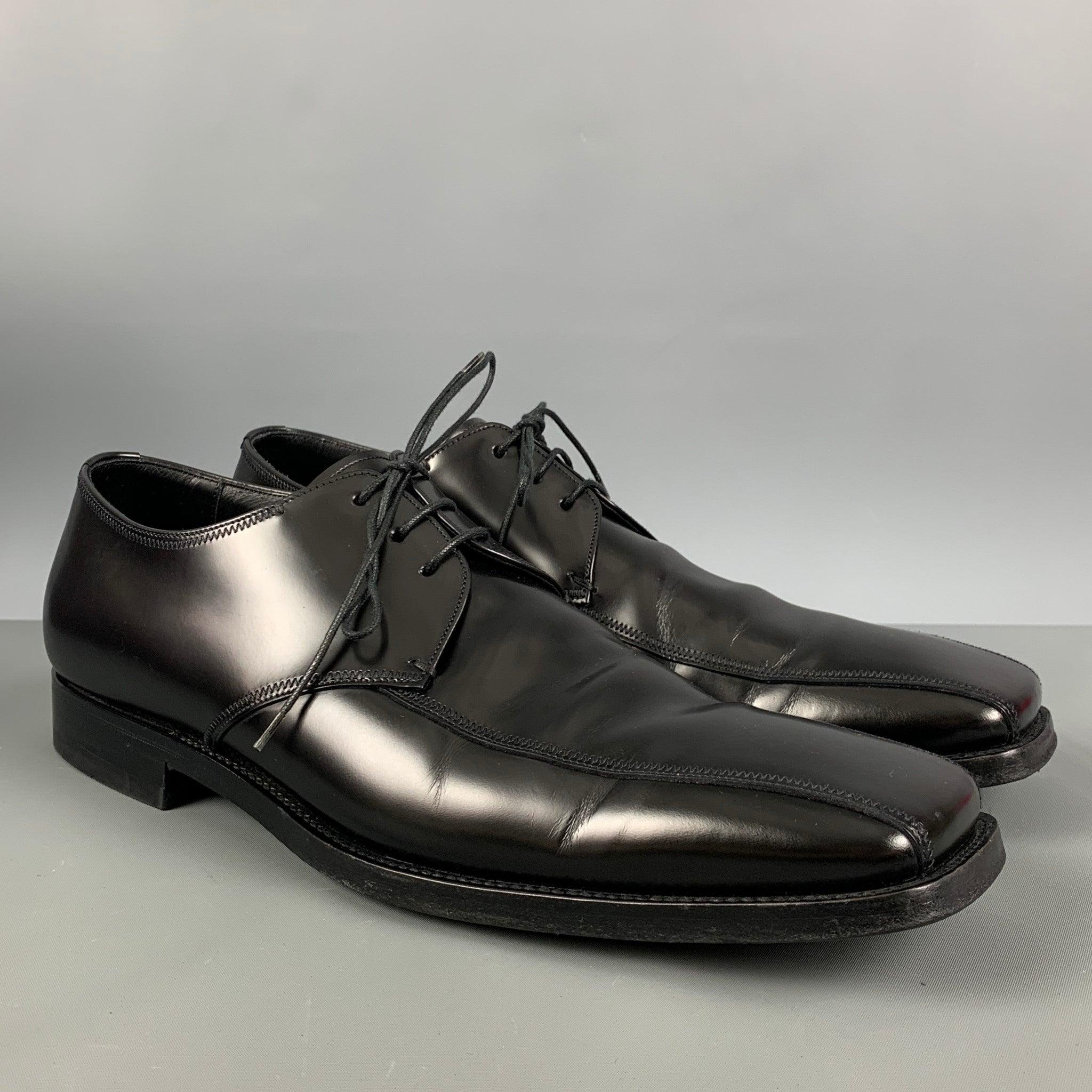 PRADA shoes comes in a black leather featuring a classic style, square toe, and a lace up closure. Includes box. Made in Italy. Excellent Pre-Owned Condition. 

Marked:   2E 1066 6360 9 1/2Outsole: 13 inches  x 4.25 in
  
  
 
Reference:
