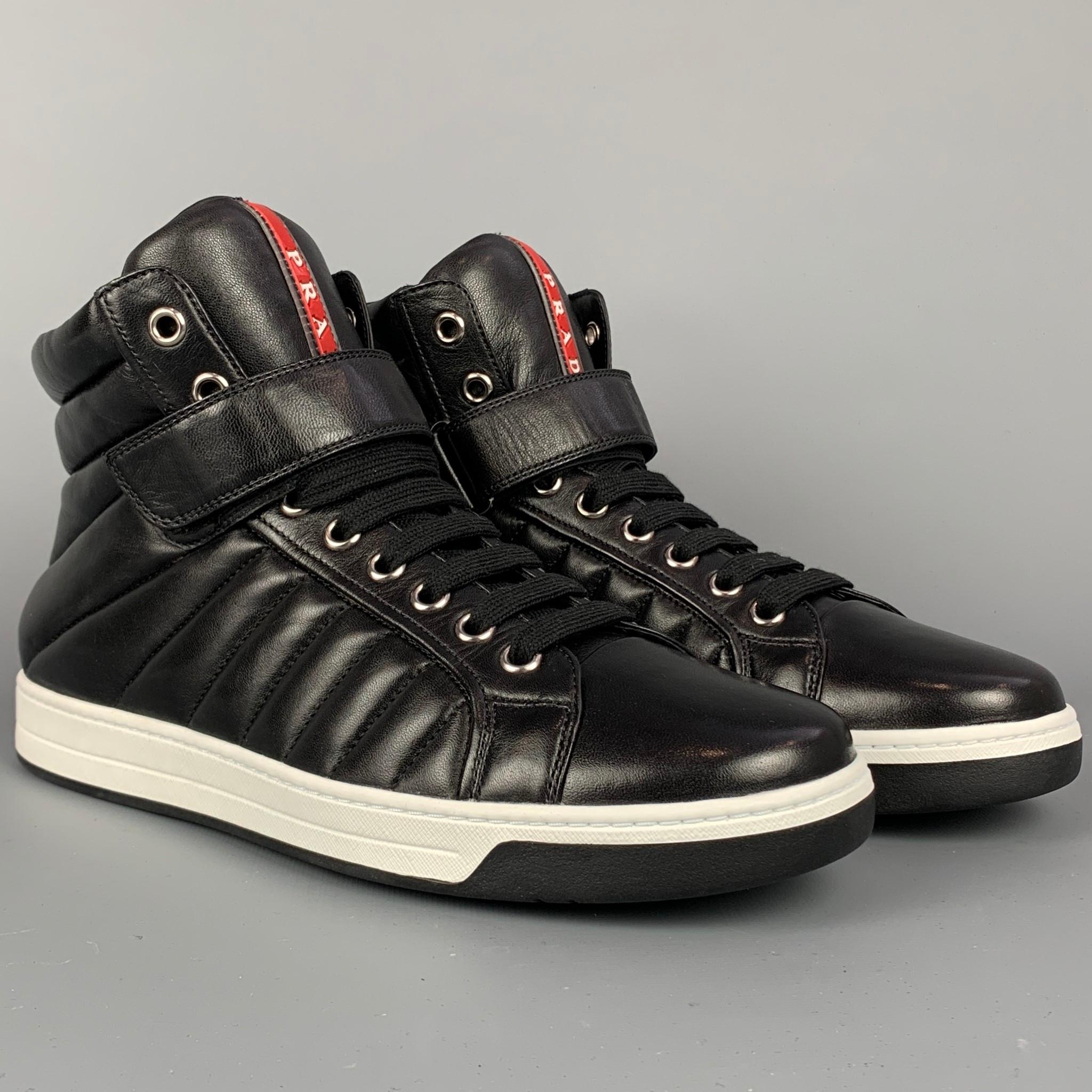 PRADA sneakers comes in a black quilted leather featuring a high top style, front strap, side zipper, rubber sole, and a lace up closure. 

New With Box. 
Marked: 4T 2726 9.5

Outsole: 4 in. x 11.5 in.