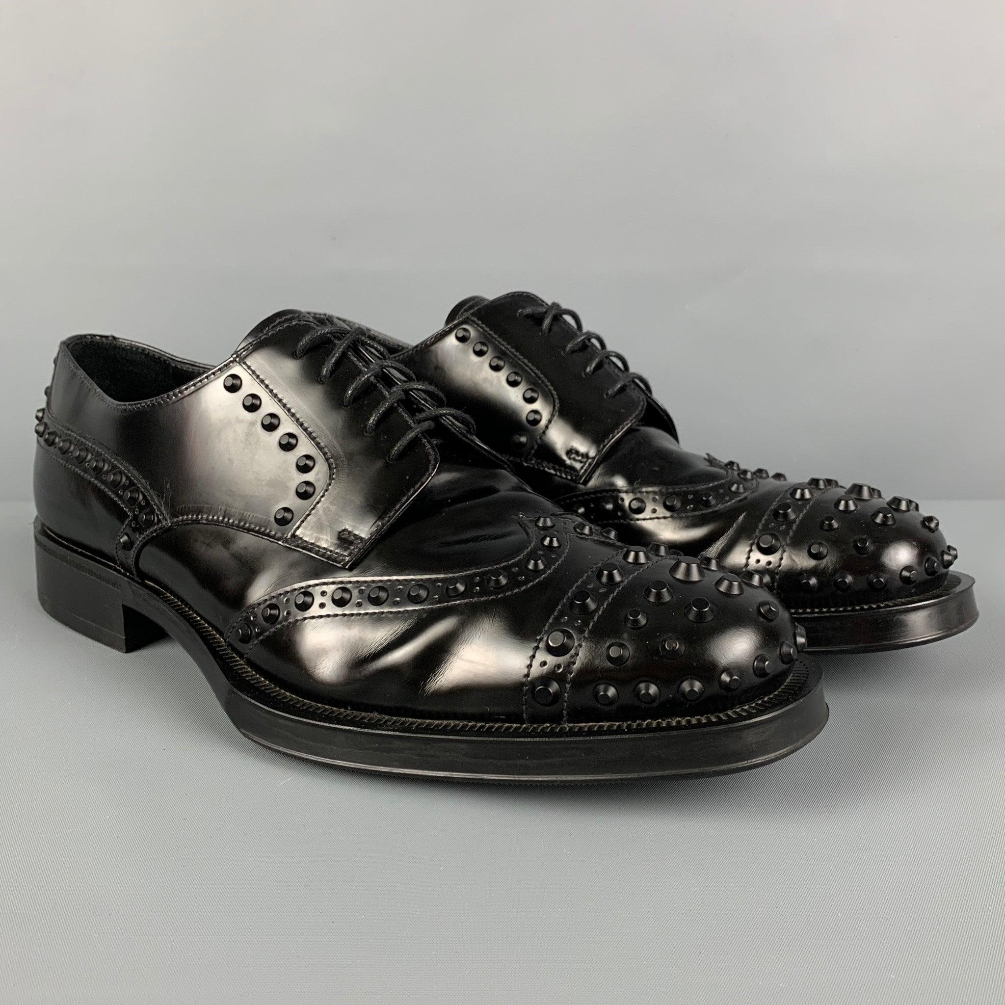 PRADA shoes comes in a black leather featuring studded details, cap toe, and a lace up closure. Made in Italy.
Very Good
Pre-Owned Condition. Light wear.  

Marked:   2EE289 9.5Outsole: 12.25 inches  x 4.5 inches 
  
  
 
Reference: 117559
Category: