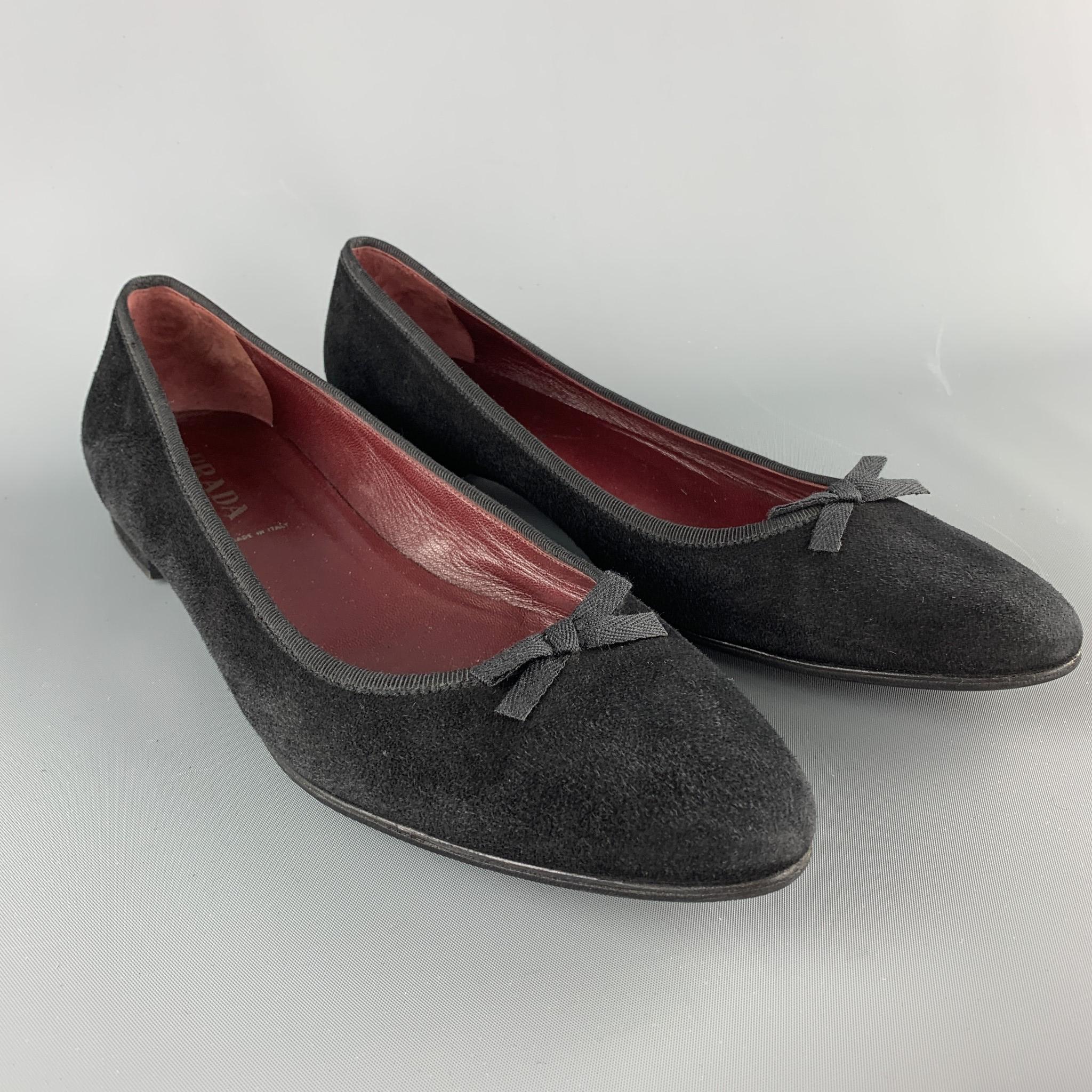 PRADA flats come in black suede with a pointed toe, low covered heel, and ribbon trim with bow accent. With box. Made in Italy.

Very Good Pre-Owned Condition.
Marked: IT 40.5

Outsole: 11 x 3.5 in.
SKU: 103617
Category: Flats

More Details
Brand:
