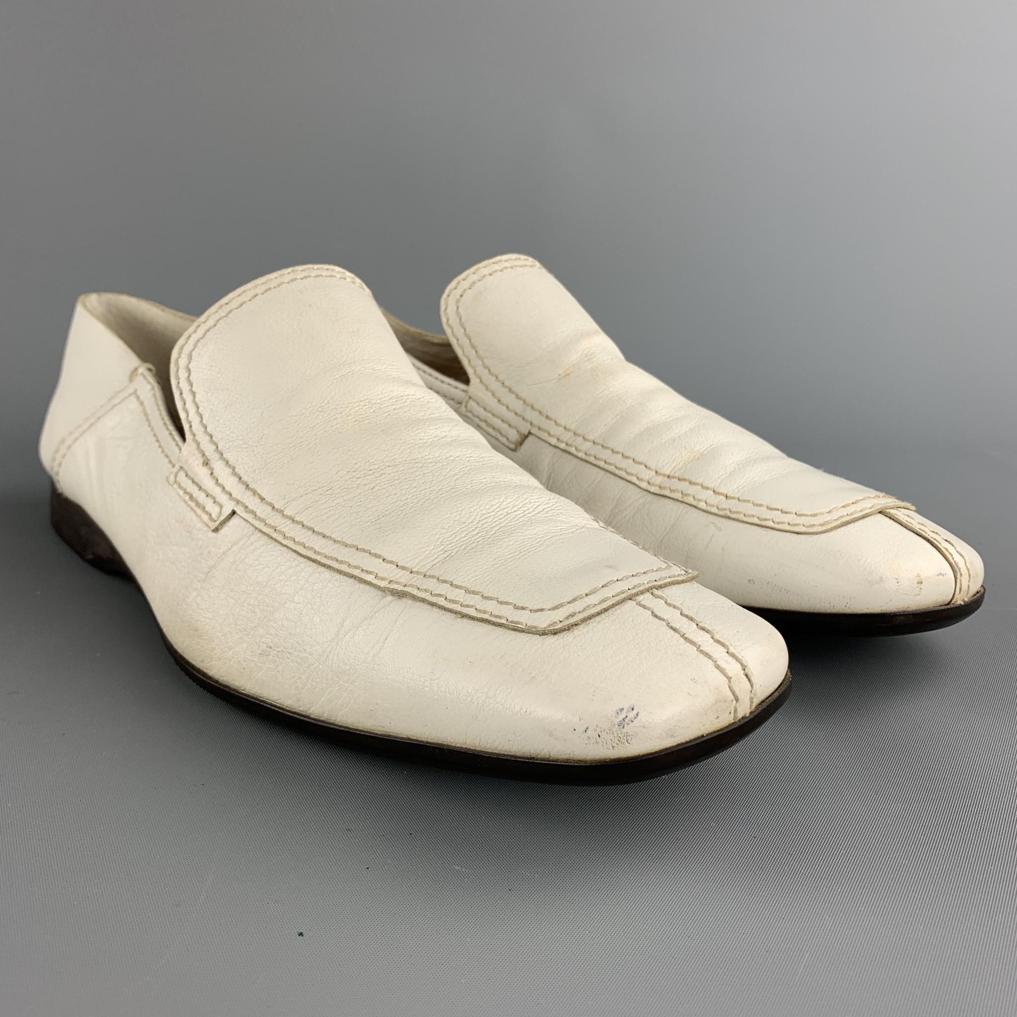 PRADA loafers comes in a white leather featuring a split toe style and a rubber sole. As-Is. Made in Italy.

Fair Pre-Owned Condition.
Marked: 9.5

Outsole:

12 in. x 3.75 in. 