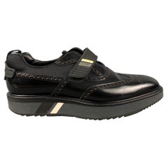 PRADA Size 11 Black Perforated Leather Wingtip Loafers