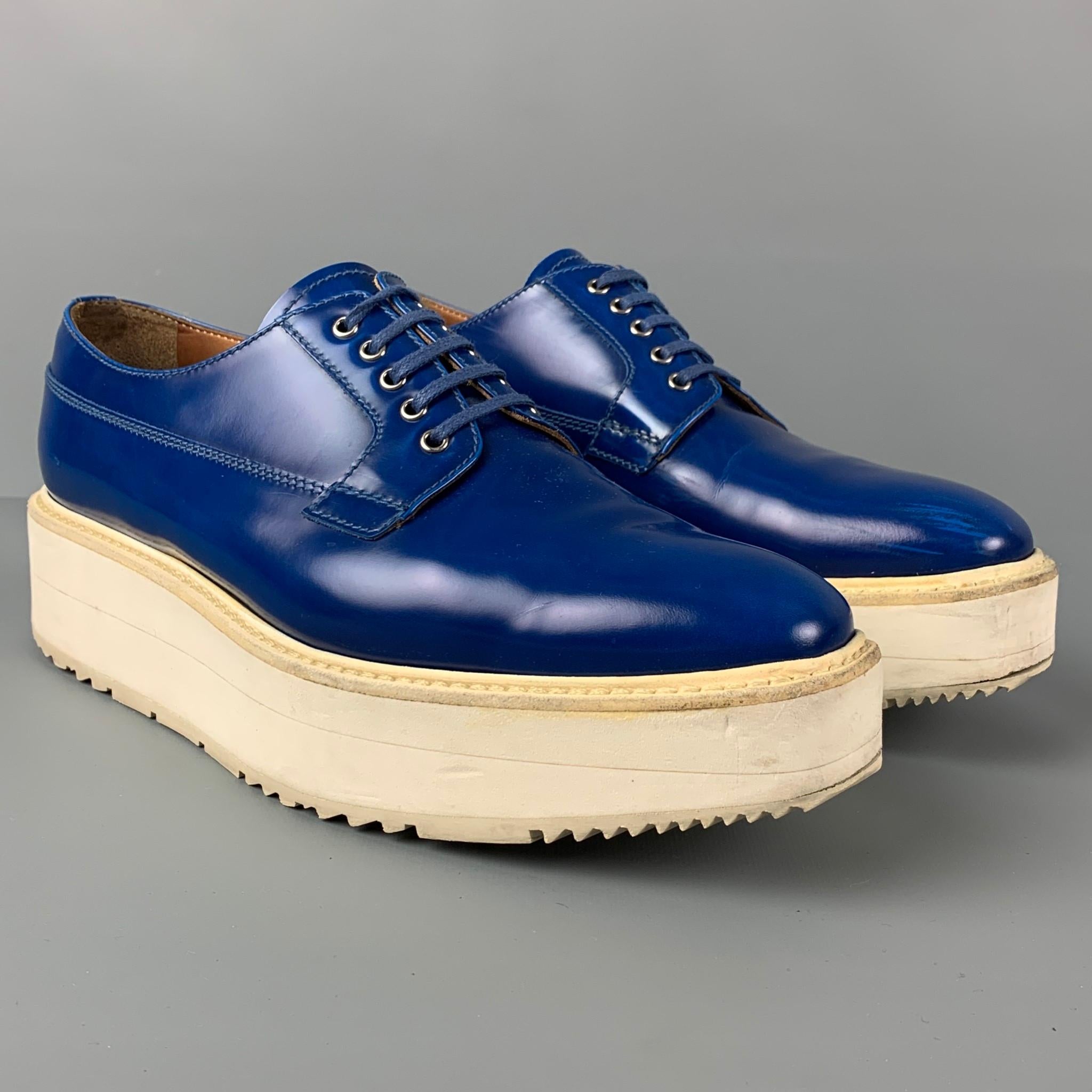 PRADA shoes comes in a royal blue leather featuring a square toe, platform, and a lace up closure. Includes box. Made in Italy. 

Very Good Pre-Owned Condition.
Marked: 41
Original Retail Price: $950.00

Outsole: 11.5 in. x 4 in. 