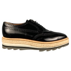 PRADA Size 11.5 Black Perforated Leather Wingtip Lace Up Shoes