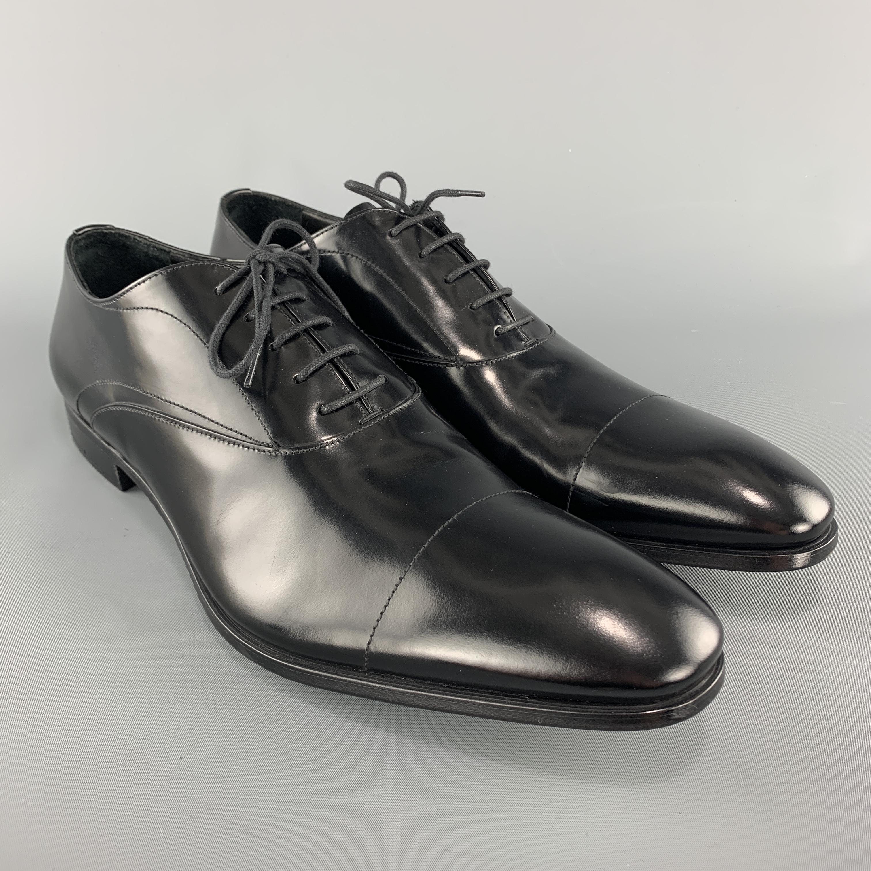 PRADA dress shoes come in polished black leather with a pointed cap toe. Never worn. Made in Italy.

Brand New. 
Marked: UK 10.5

Outsole: 12.75 x 4.25 in. 