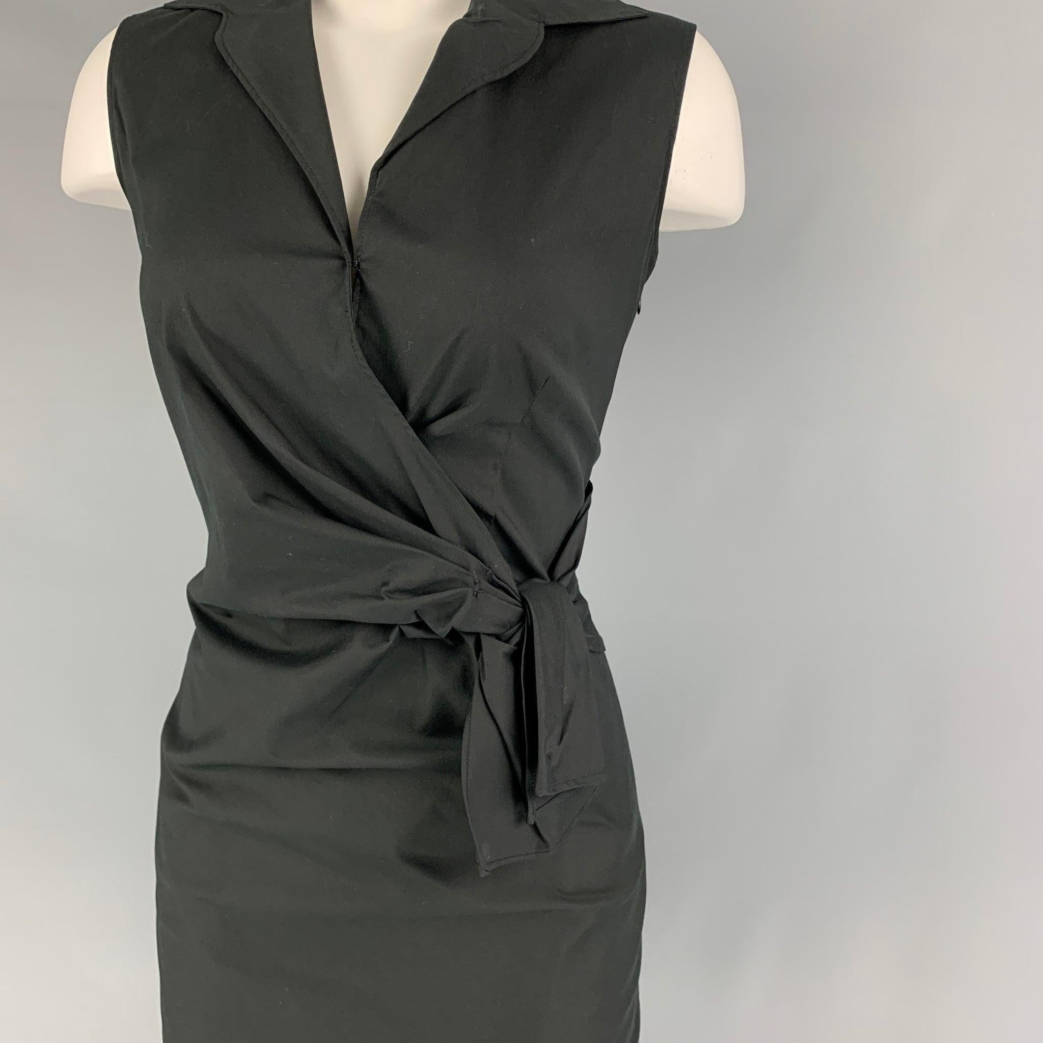 PRADA dress comes in a black cotton blend featuring a front bow design, spread collar, hook & loop detail, sleeve;ess, and a side zipper closure. Made in Italy.
 New with tags.
  
 

 Marked:  38 
 

 Measurements: 
  
 Shoulder: 14 inches Bust: 29