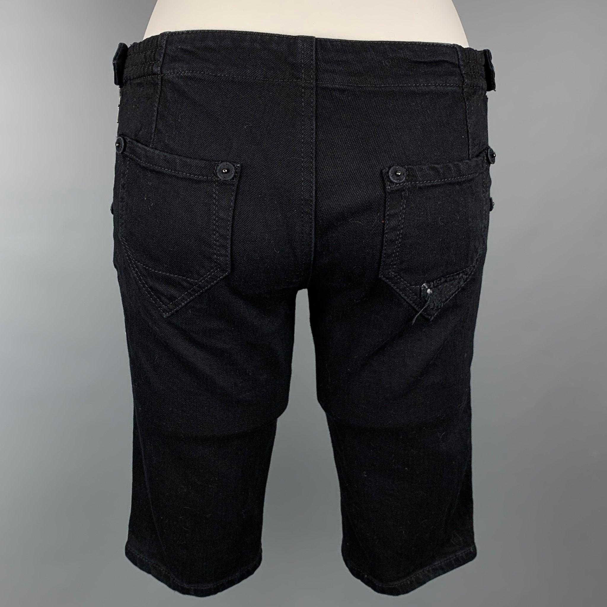 PRADA shorts comes in a black denim featuring front & back pockets and a side button and zipper closure. Made in Italy.Very Good
Pre-Owned Condition. 

Marked:   26 

Measurements: 
  Waist: 28 inches  Rise: 8 inches  Inseam: 12.5 inches 
  
  
