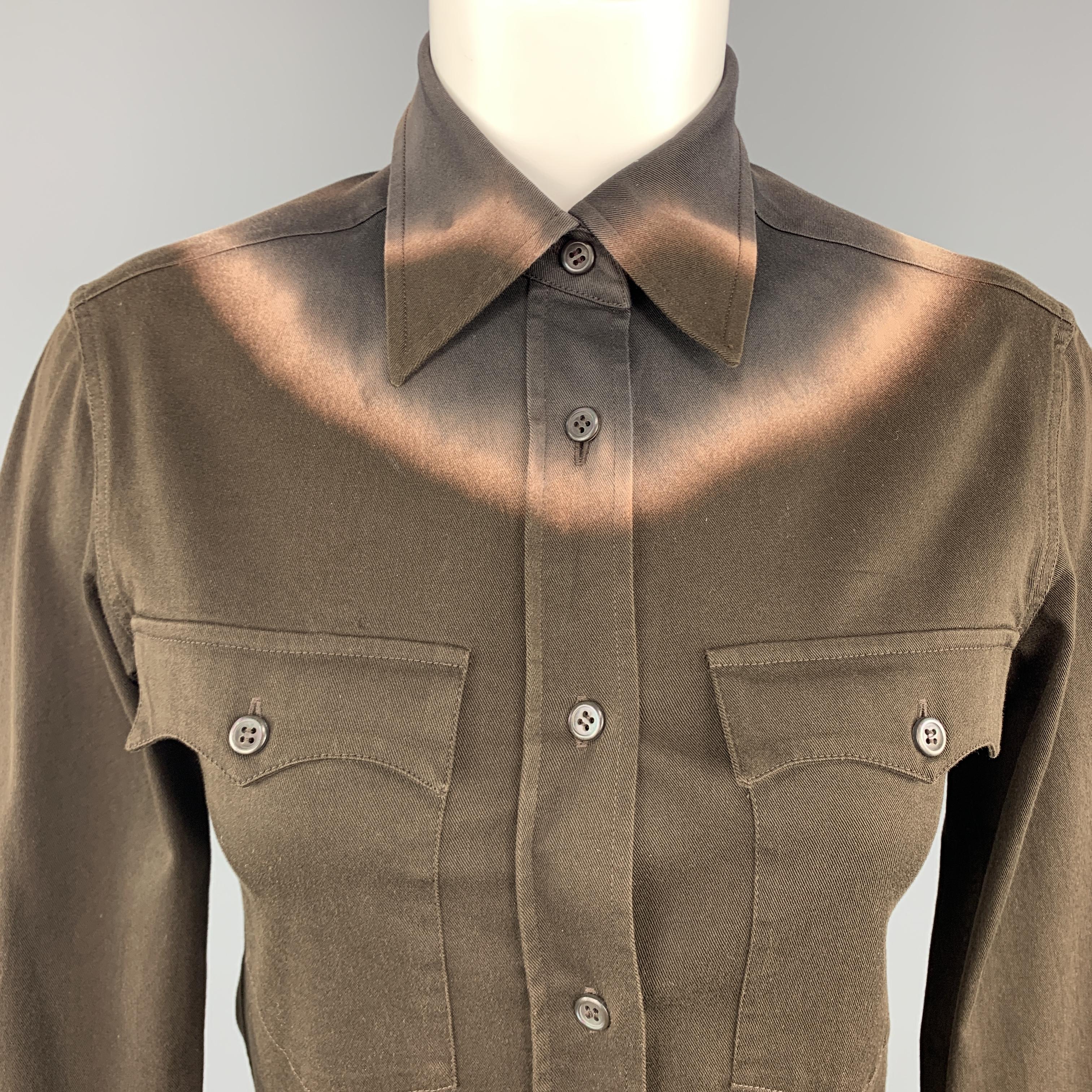 PRADA top comes in brown stretch cotton twill with a pointed collar, patch flap pockets, and tie die effect detail along top. Made in Italy.
 
Very Good Pre-Owned Condition.
Marked: IT 38
 
Measurements:
 
Shoulder: 14 in.
Bust: 34 in.
Sleeve: 23