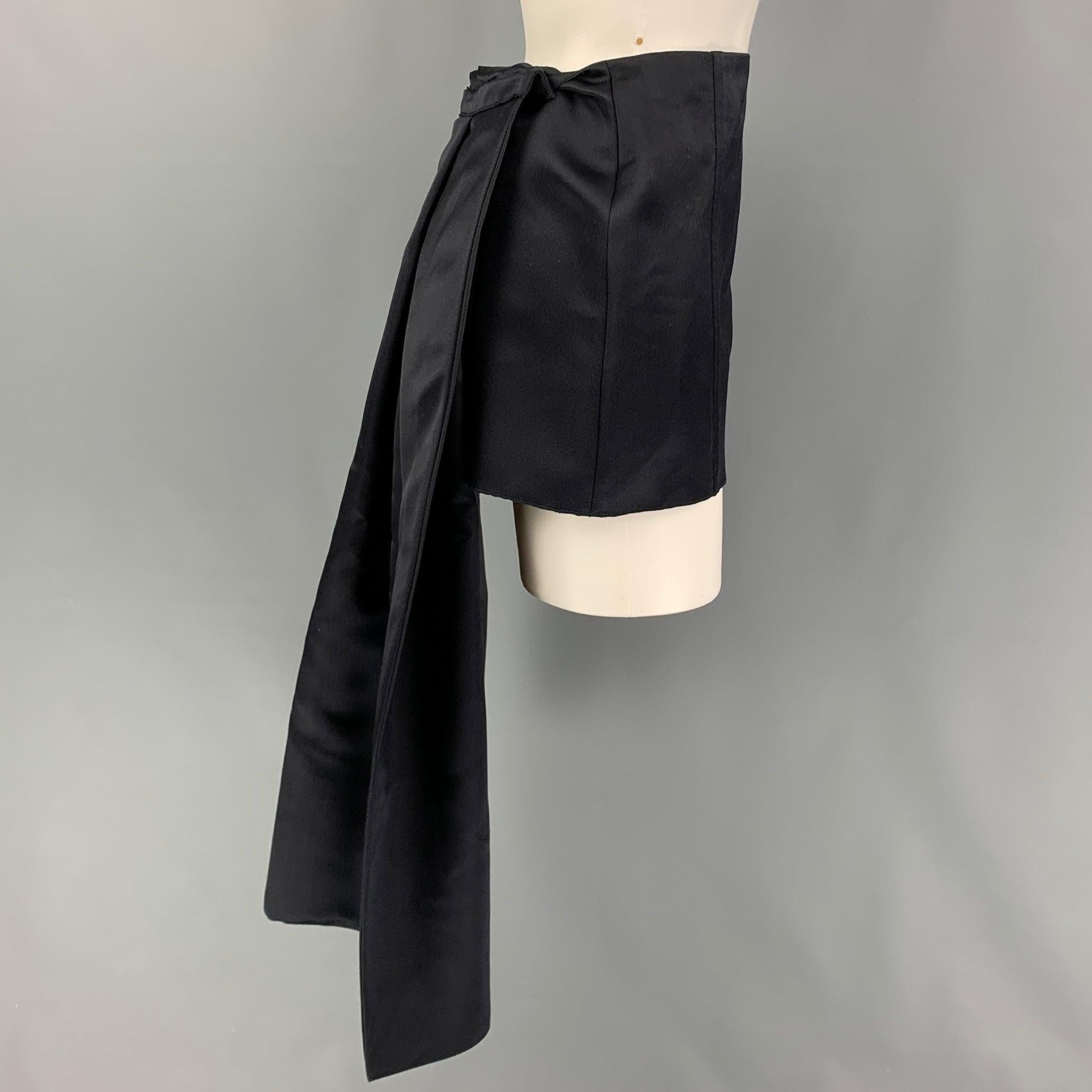 PRADA Spring-Summer 2022 mini skirt comes in a navy satin silk featuring a detachable train design and side zipper closure. Made in italy.
Very Good
Pre-Owned Condition. 

Marked:   38 

Measurements: 
  Waist: 29 inches  Hip: 36 inches  Skirt