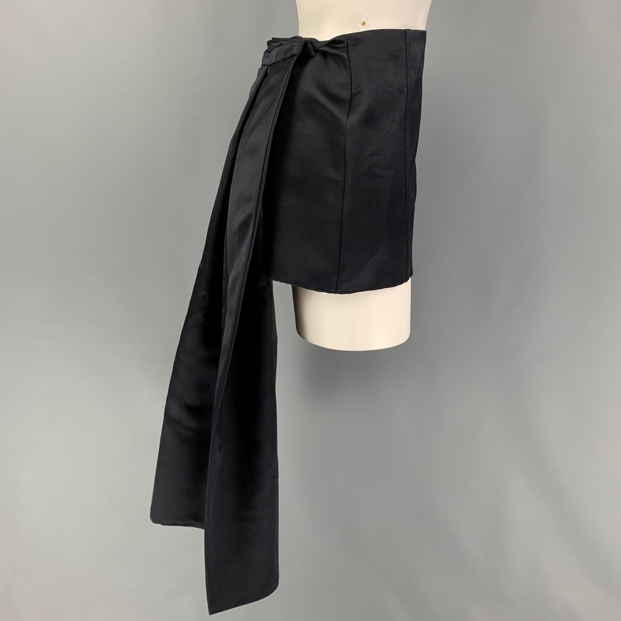 PRADA Spring-Summer 2022 mini skirt comes in a navy satin silk featuring a detachable train design and side zipper closure. Made in italy. 

Very Good Pre-Owned Condition.
Marked: 38

Measurements:

Waist: 29 in.
Hip: 36 in.
Skirt Length: 11.5