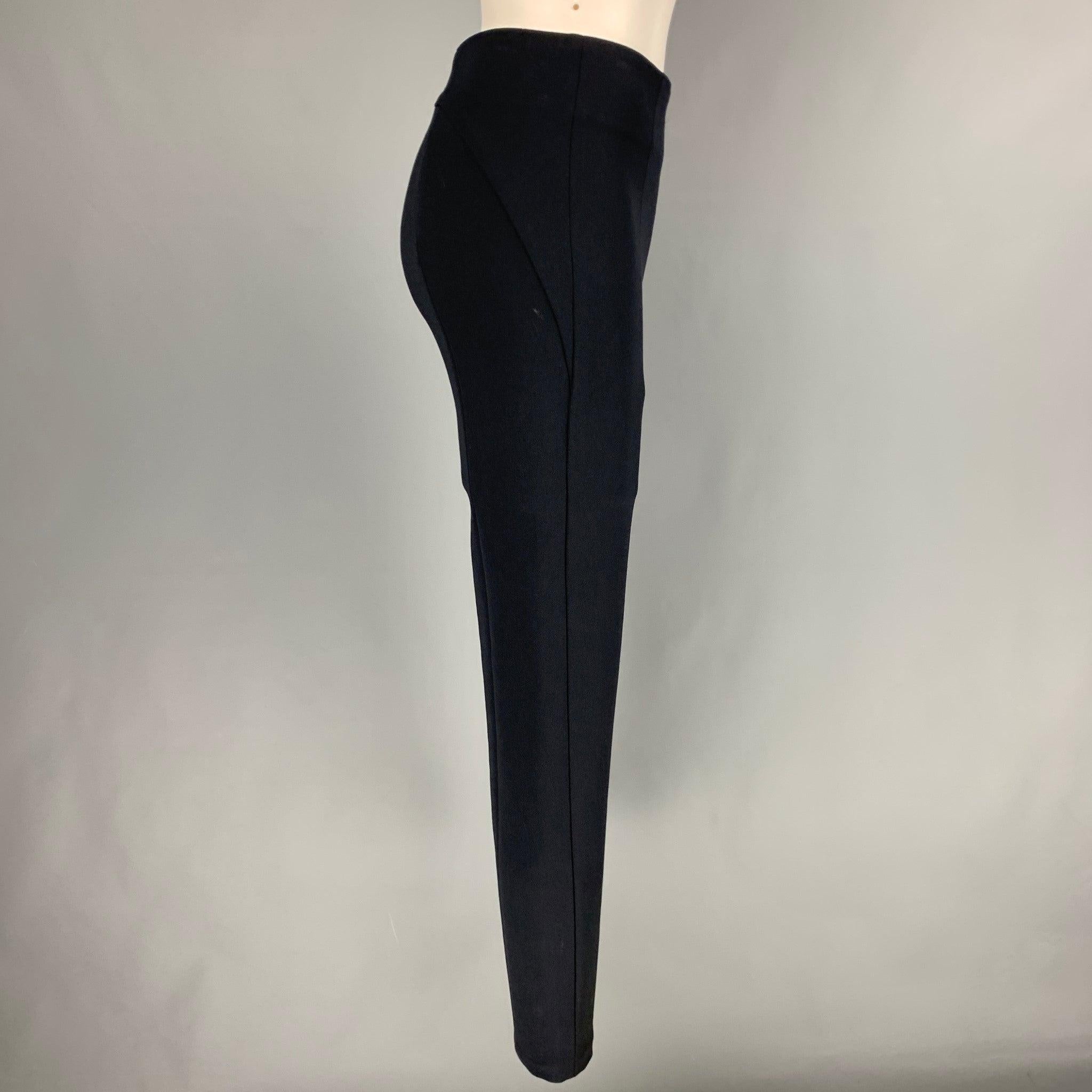 PRADA dress pants
in a navy nylon blend fabric featuring a narrow leg style, ankle zips, and side zipper closure.Very Good Pre-Owned Condition. Minor signs of wear. 

Marked:   38 

Measurements: 
  Waist: 27 inches Rise: 11 inches Inseam: 29 inches