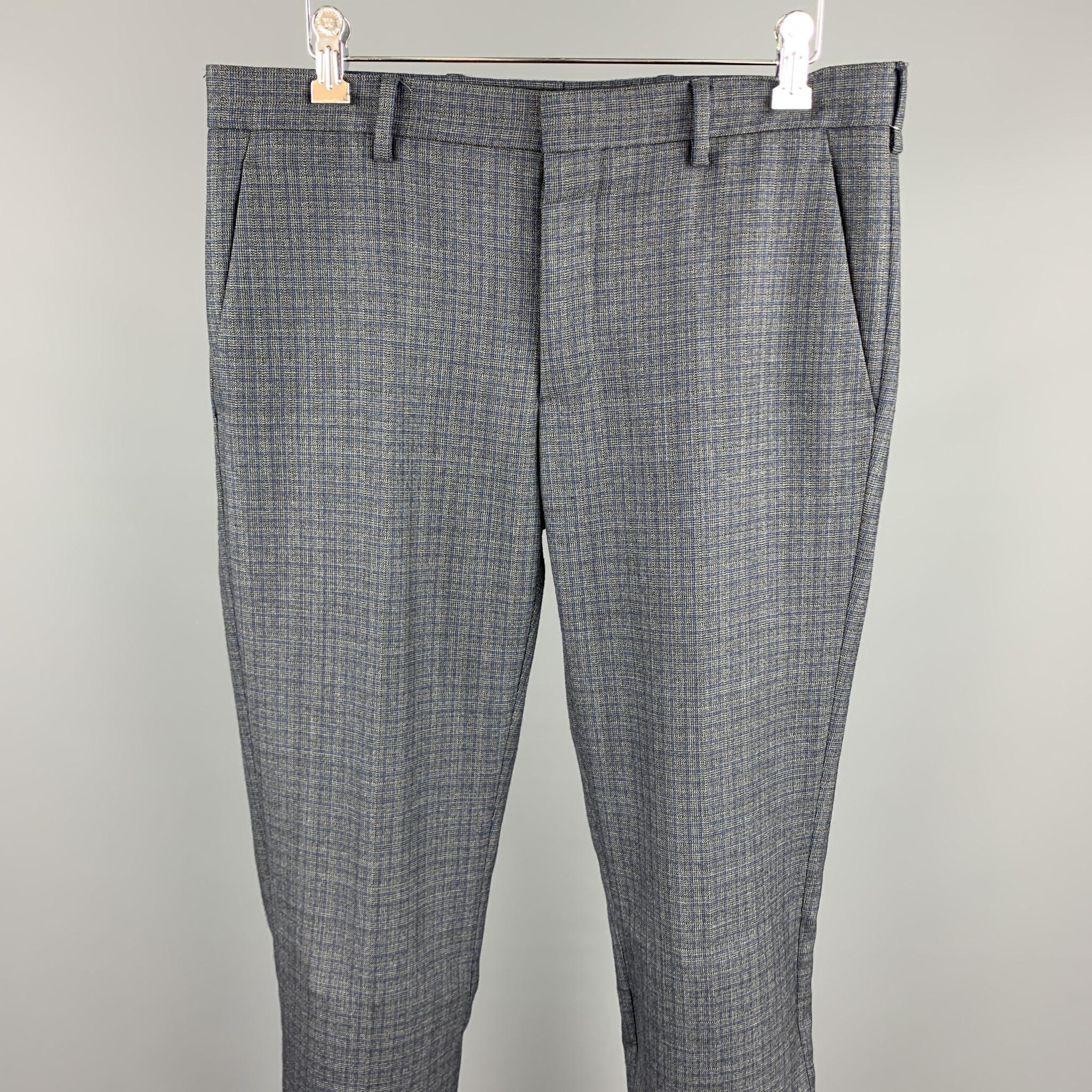 PRADA dress pants comes in a gray wool featuring a flat front and a button fly closure. Made in Italy.

Excellent Pre-Owned Condition.
Marked: IT 46

Measurements:

Waist: 32 in. 
Rise: 8.5 in. 
Inseam: 34 in. 