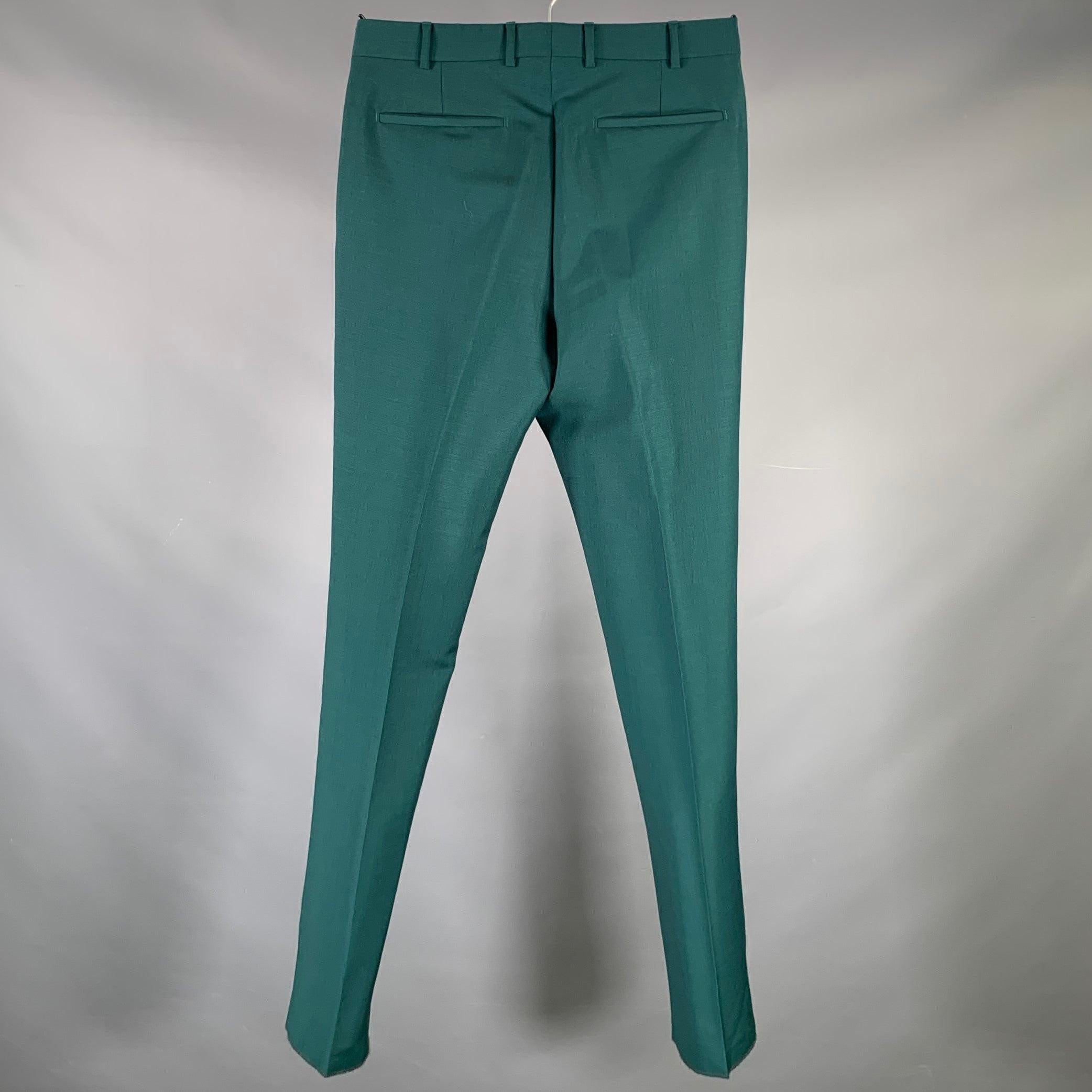 PRADA dress pants
in a
green wool mohair blend fabric featuring straight leg style, and button fly closure. Made in Italy.Very Good Pre-Owned Condition. Minor mark. 

Marked:   46R 

Measurements: 
  Waist: 30 inches Rise: 10 inches Inseam: 34