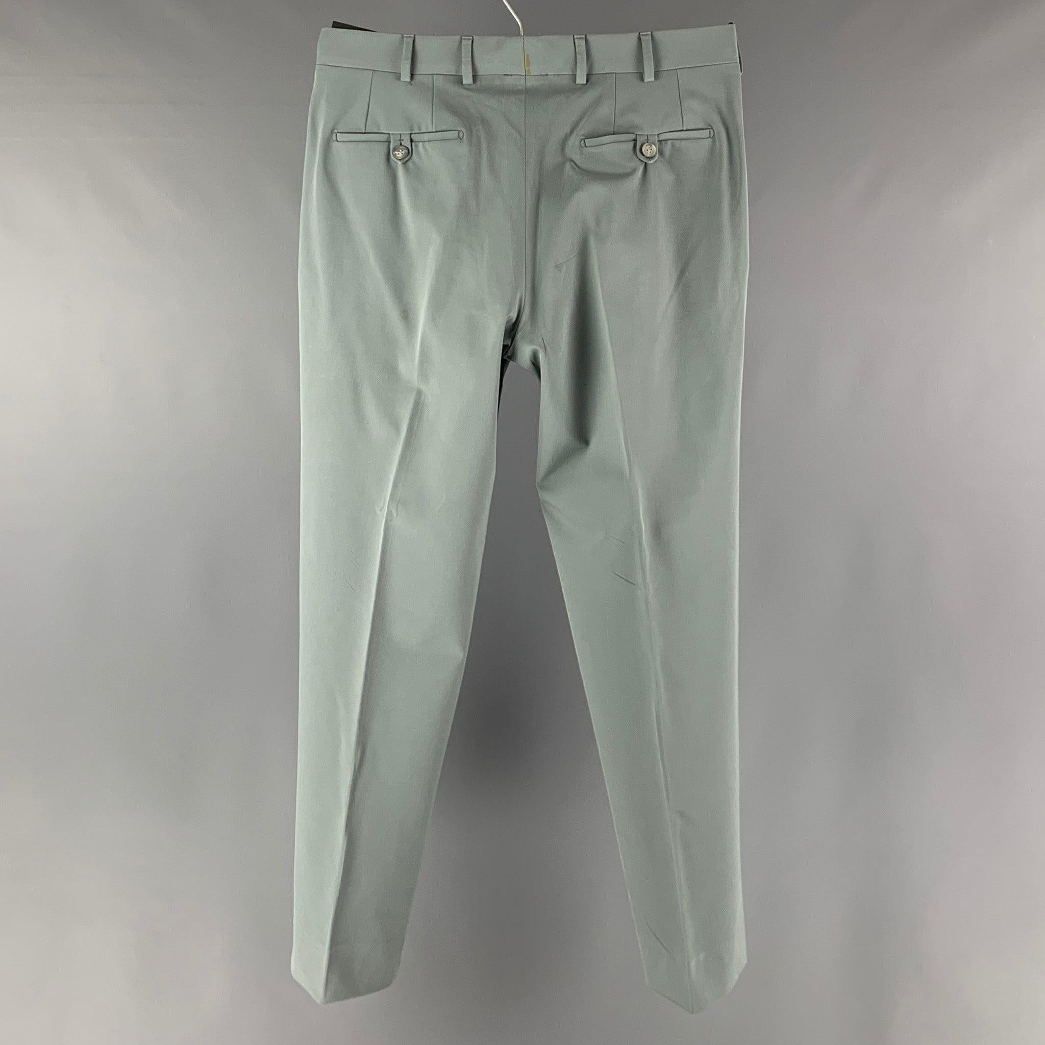 PRADA casual pants comes in a grey polyester blend knit material featuring a regular fit, flat front, and a button zipper fly closure. Made in Italy.Very Good Pre- Owned Conditions. Altered. 

Marked:  48 

Measurements: 
 Waist: 32 inches Rise: 9.5