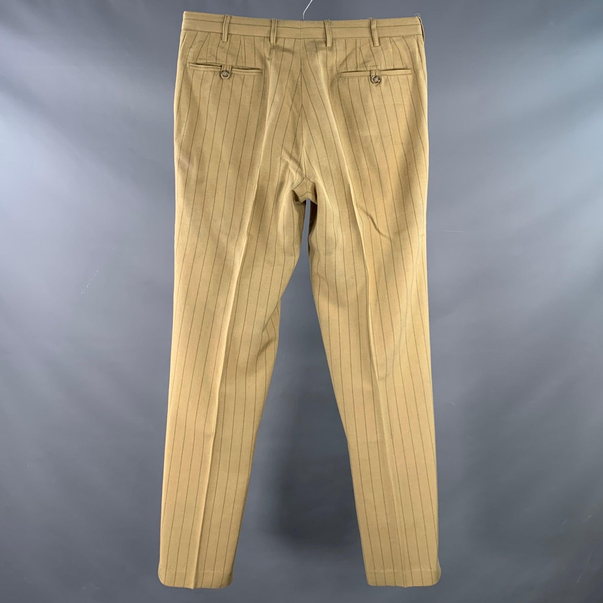 PRADA dress pants
in a tan and brown polyester linen woven blend fabric featuring a pinstripe pattern, flat front, and button fly closure. Made in Italy.Good Pre-Owned Condition. Multiple minor marks, small repairs at pockets. As is. 

Marked:   IT
