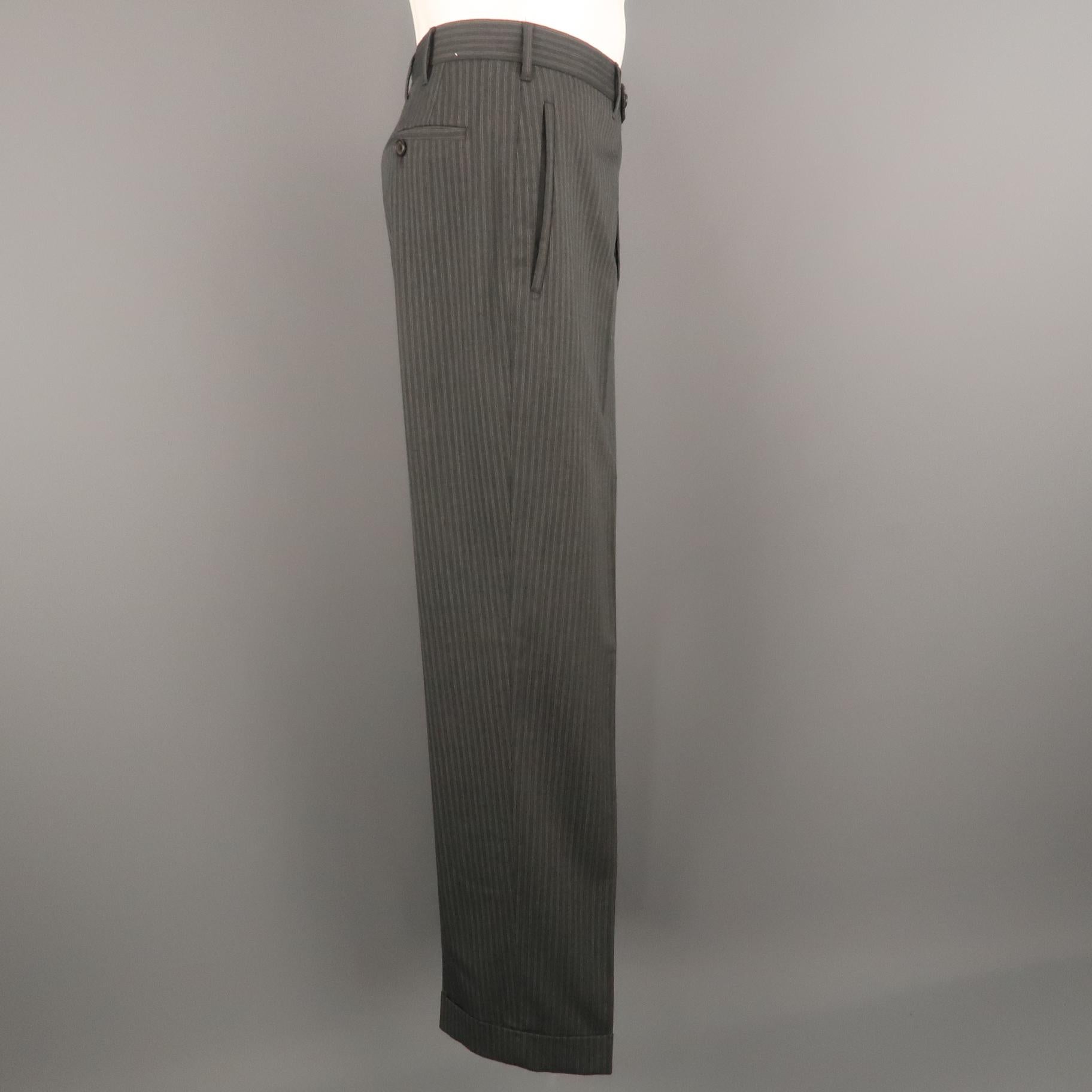 PRADA dress pant comes in a gray striped wool blend featuring a flat front style and a front tab closure. Made in Italy.
 
Excellent Pre-Owned Condition.
Marked: IT 52
 
Measurements:
 
Waist: 36 in.
Rise: 9 in.
Inseam: 30.5 in.
