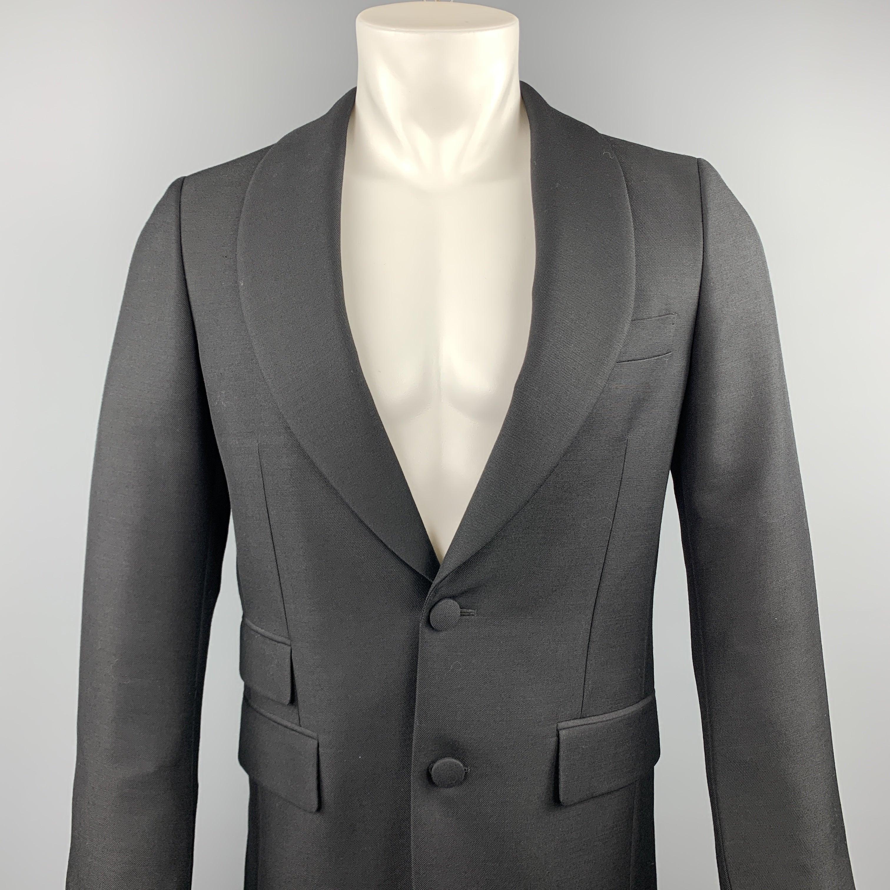 PRADA sport coat comes in a black wool / mohair featuring a shawl lapel style, flap pockets, and a two button closure. Made in Italy.Excellent Pre-Owned Condition. 

Marked:   IT 46 

Measurements: 
 
Shoulder: 16 inches Chest: 36 inches 
Sleeve: 27