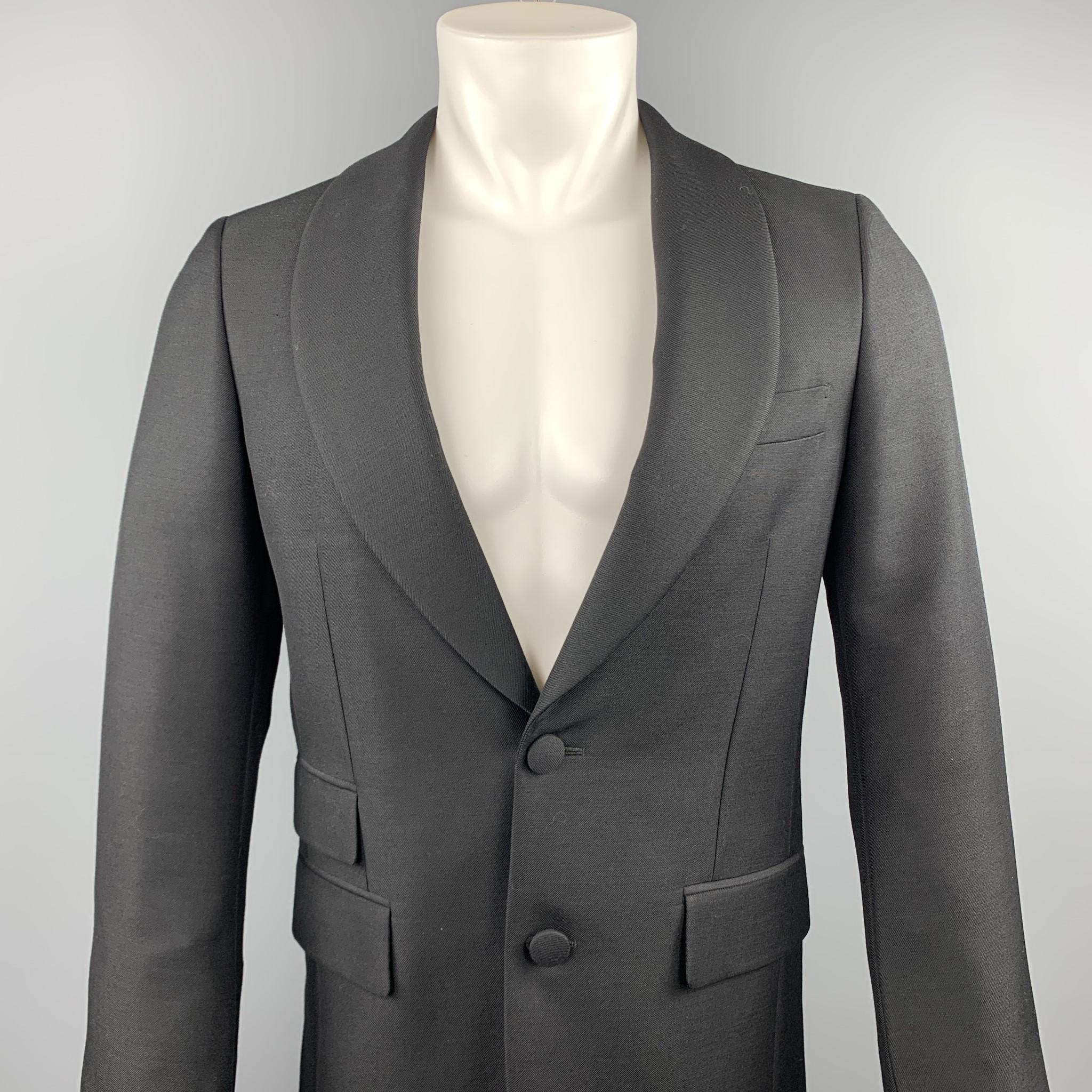 PRADA sport coat comes in a black wool / mohair featuring a shawl lapel style, flap pockets, and a two button closure. Made in Italy.

Excellent Pre-Owned Condition.
Marked: IT 46

Measurements:

Shoulder: 16 in.
Chest: 36 in. 
Sleeve: 27 in.