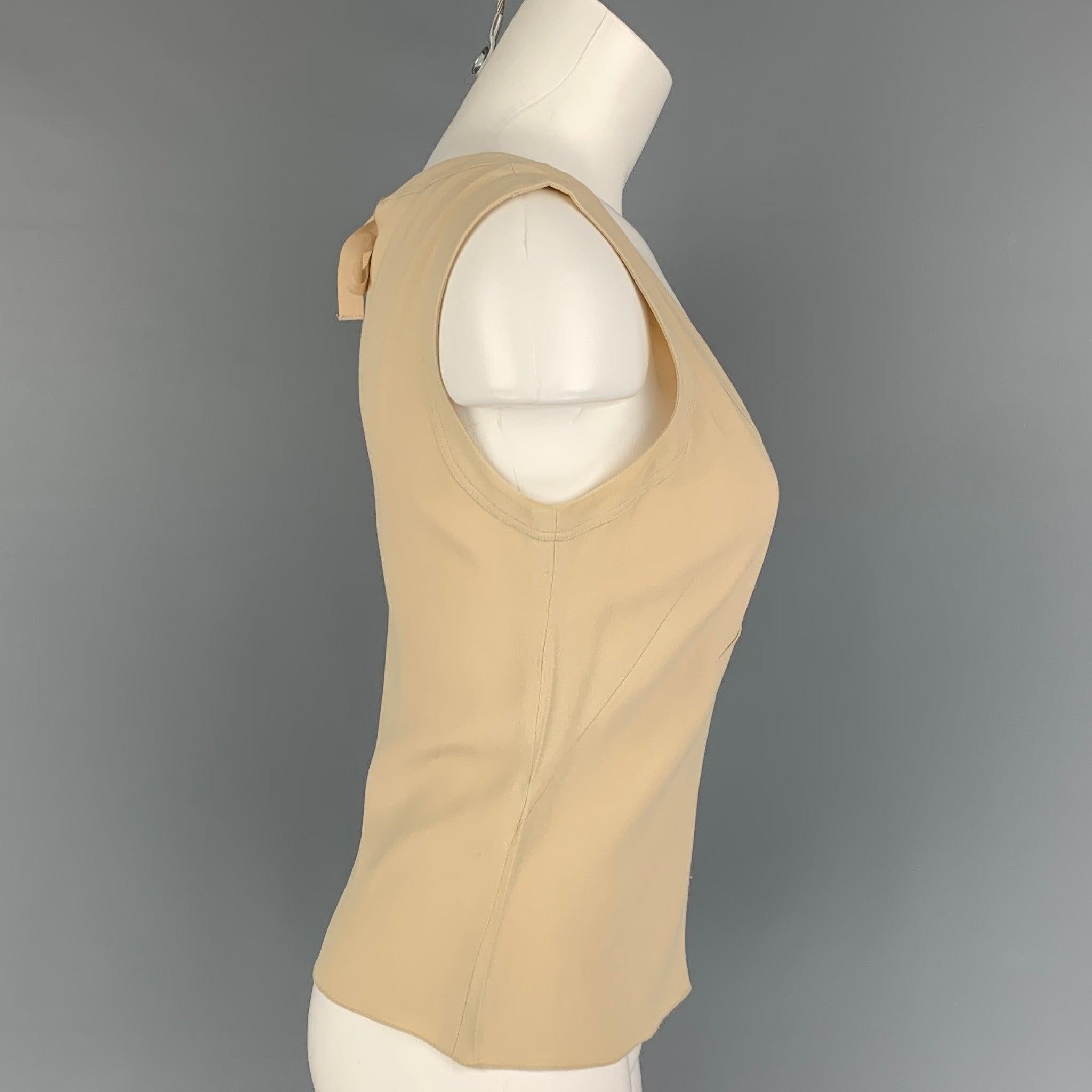PRADA dress top comes in a beige acetate / viscose featuring a sleeveless style, pleated details, and a back self-tie closure. Made in Italy.
 Very Good
 Pre-Owned Condition. Light discoloration at under arm.  
 

 Marked:  40 
 

 Measurements: 
 