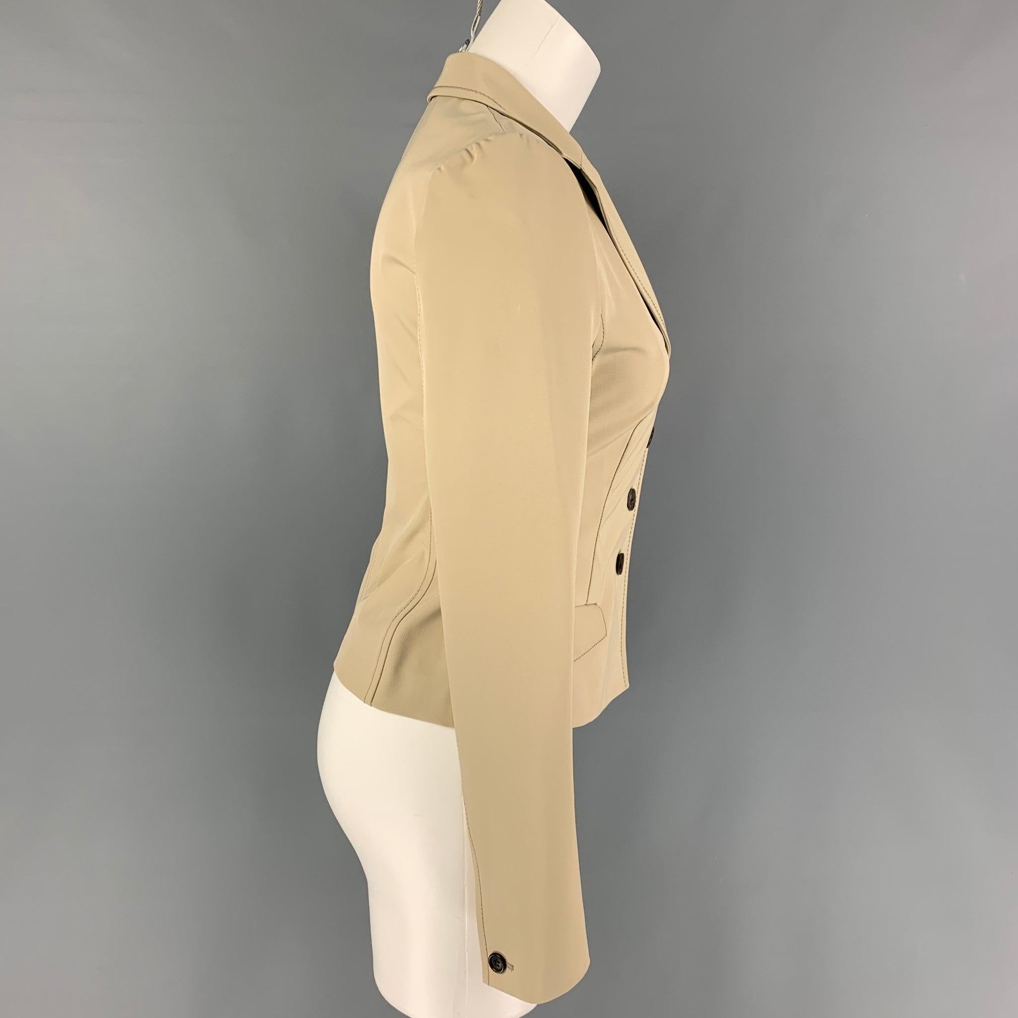 PRADA jacket comes in a beige polyester featuring a notch lapel, contrast stitching, flap pockets, and a buttoned closure. Made in Italy.
Very Good
Pre-Owned Condition. 

Marked:   40 

Measurements: 
 
Shoulder: 15 inches  Bust: 32 inches  Sleeve: