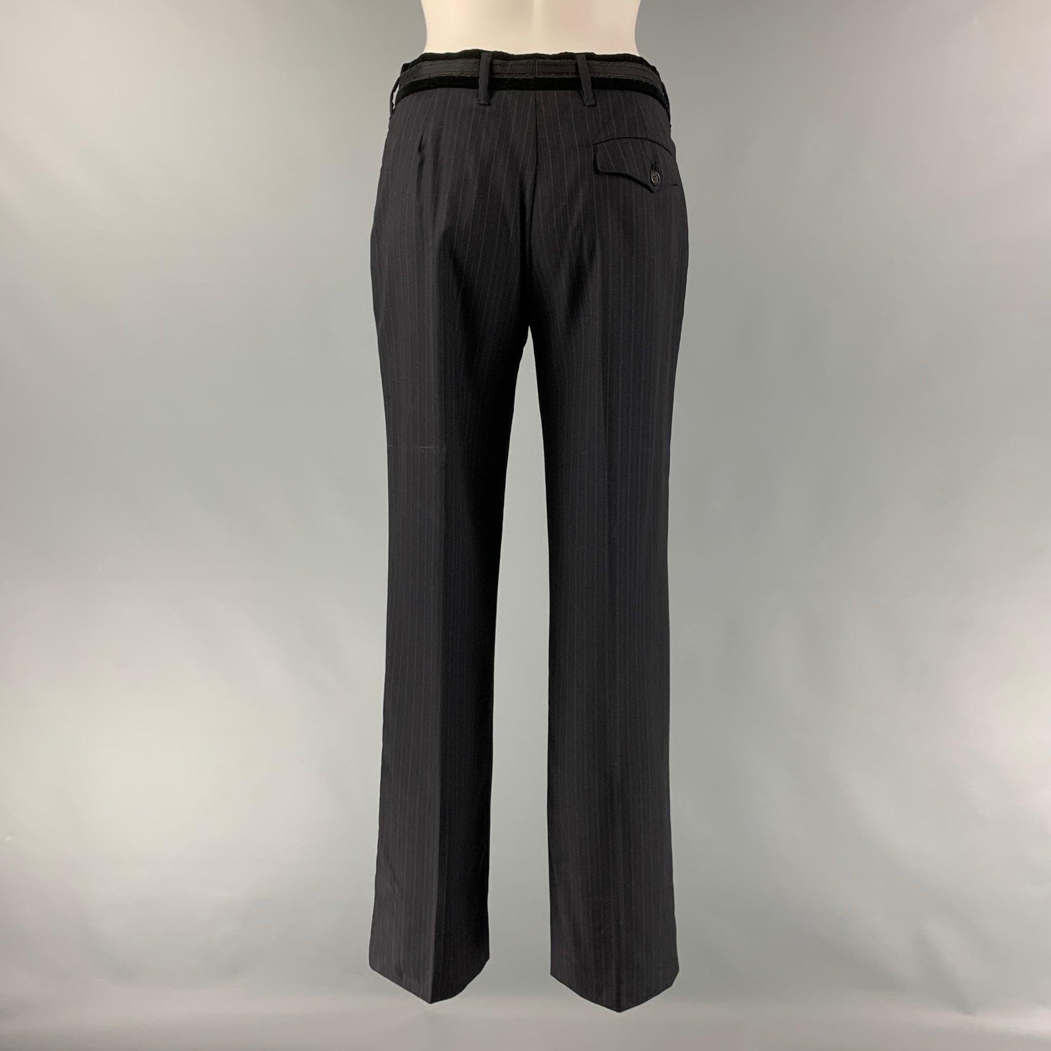 PRADA dress pants comes in a black pinstripe virgin wool featuring a straight style, velvet belt detail, front tab, and a zip fly closure. Made in Italy.Very Good Pre-Owned Condition. Minor Signs of Wear. As- Is. 
 

 Marked:  I
 40 
 

