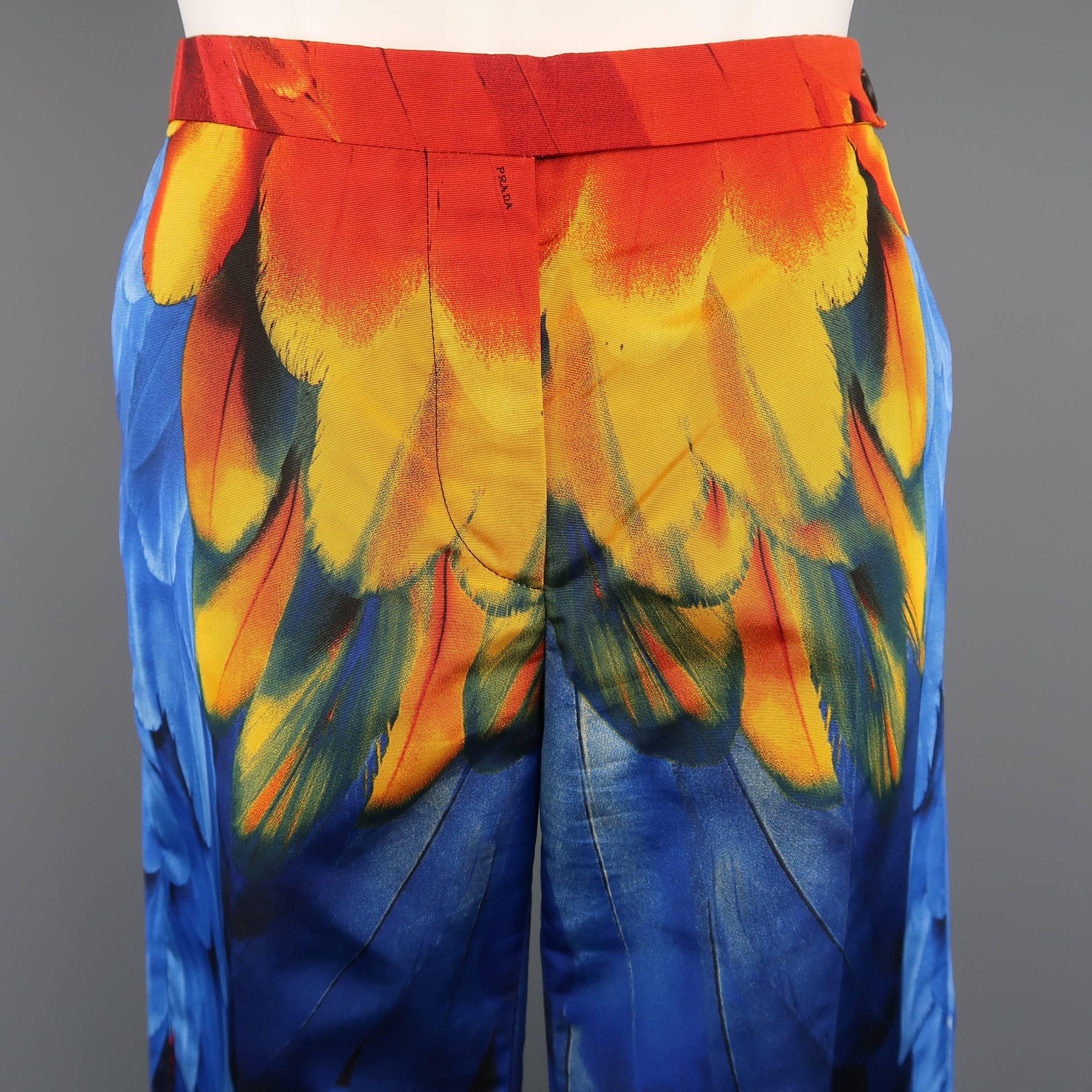 These rare archive PRADA dress pants from Spring 2005 Collection come in a light weight silk faille with all over multi-color parrot feathers print. Shown on the runway as shorts. Made in Italy.
 
Excellent Pre-Owned Condition.
Marked: IT 40
