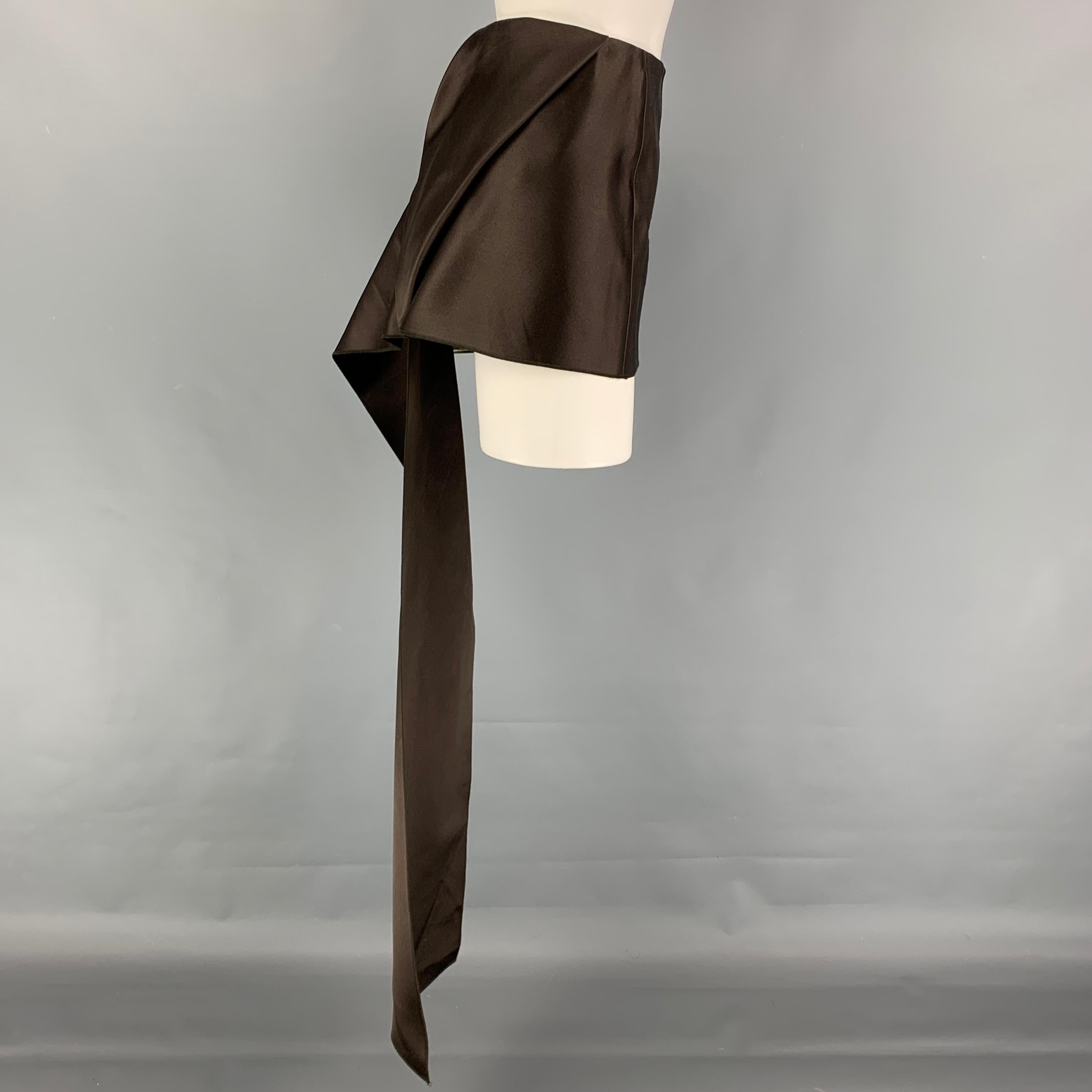 PRADA skirt comes in a brown satin silk featuring a back train design, top stitching, and a side zipper closure. Made in Italy. 

Excellent Pre-Owned Condition.
Marked: 40
Original Retail Price: $1,920.00

Measurements:

Waist: 30 in.
Length: 11 in. 