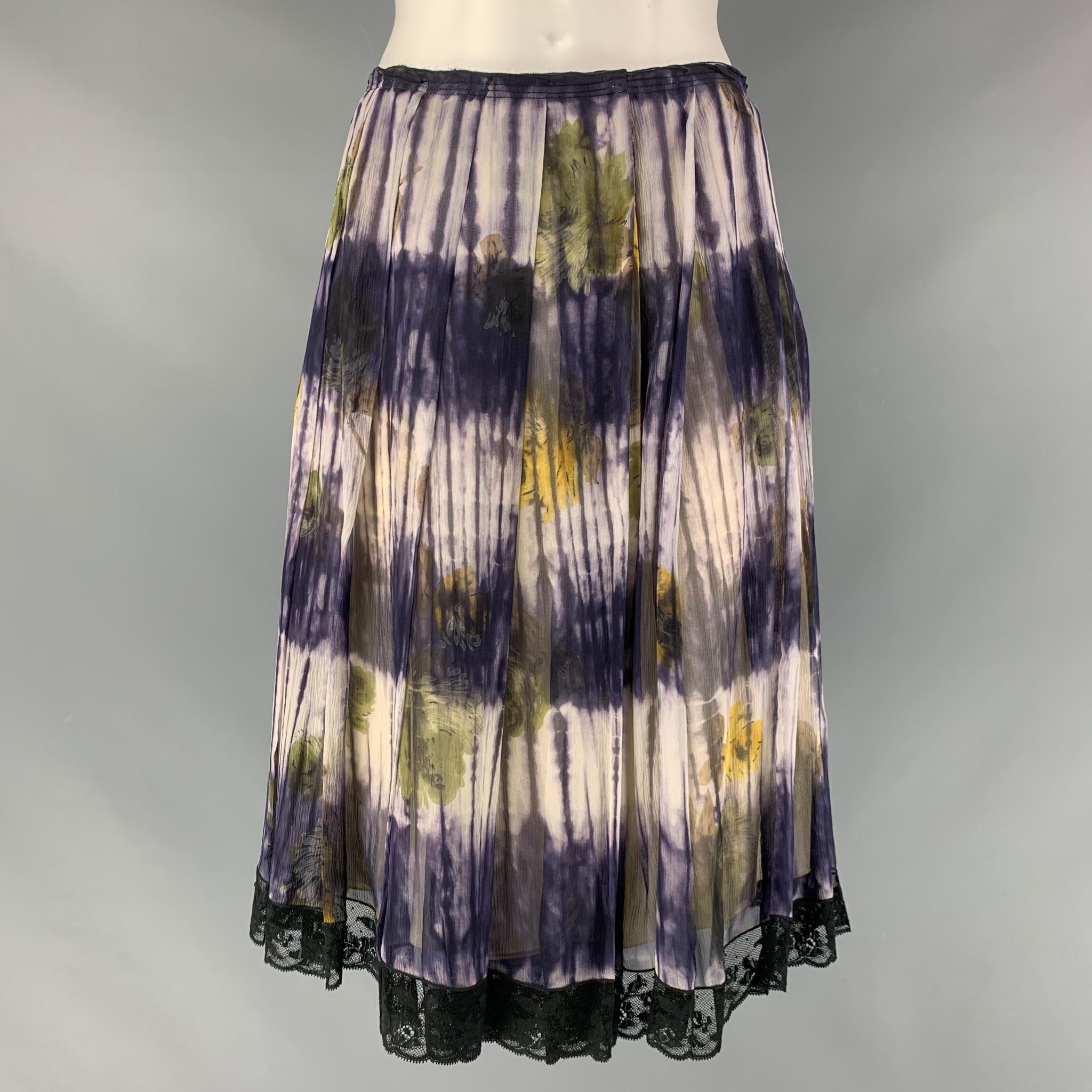 PRADA pleated skirt comes in a cream and purple floral silk featuring a black lace trim and a side snap button closure. Made in Italy.

Excellent Pre-Owned Condition.
Marked: 40

Measurements:

Waist: 27 in.
Hip: 37 in.
Length: 23.5 in.  

 