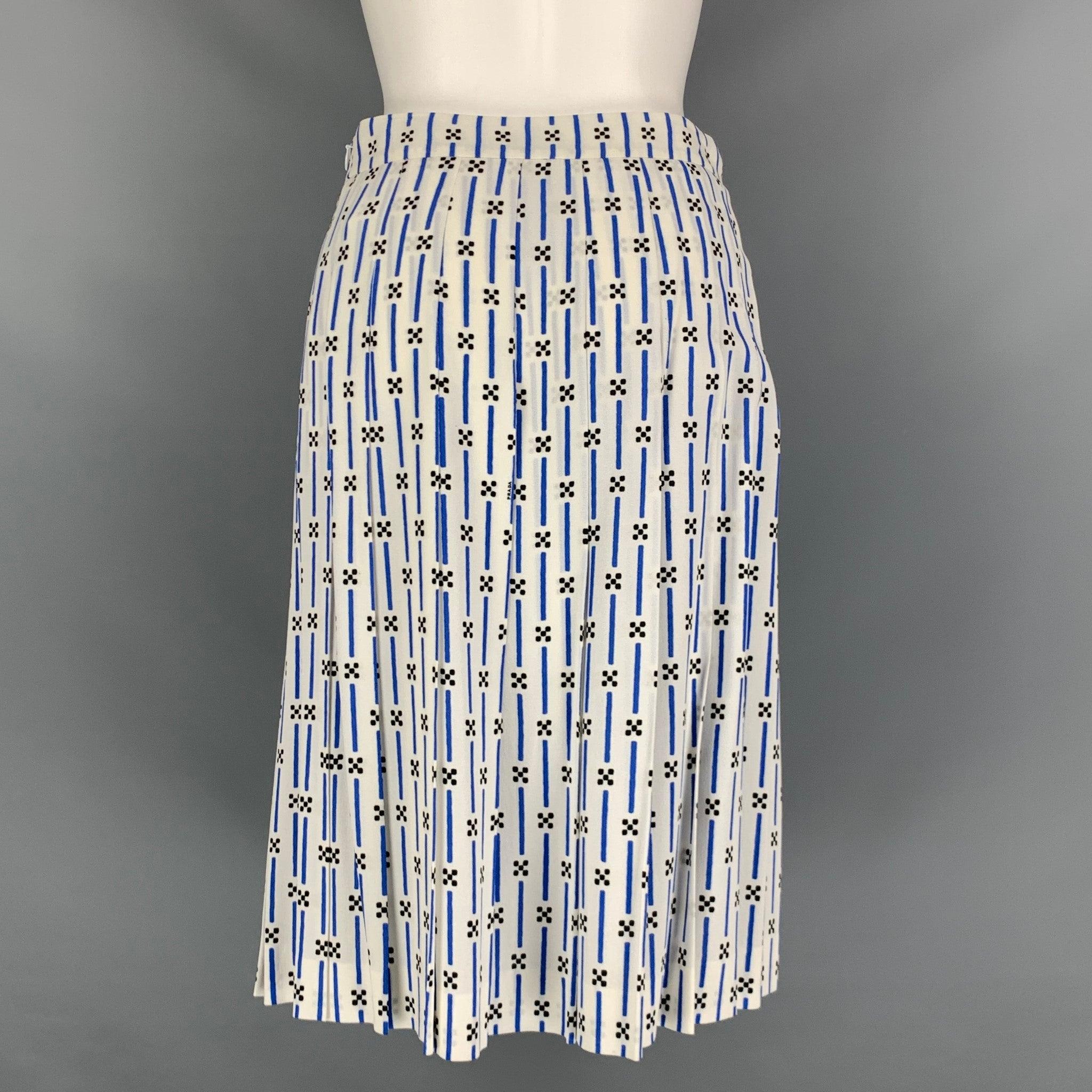 PRADA skirt comes in a blue and white viscose and elastane woven material featuring a pleated style, mid-calf length, and a back zip up closure. Made in Italy.Excellent Pre-Owned Condition. 

Marked:   40 

Measurements: 
  Waist: 28 inches Hip: 38