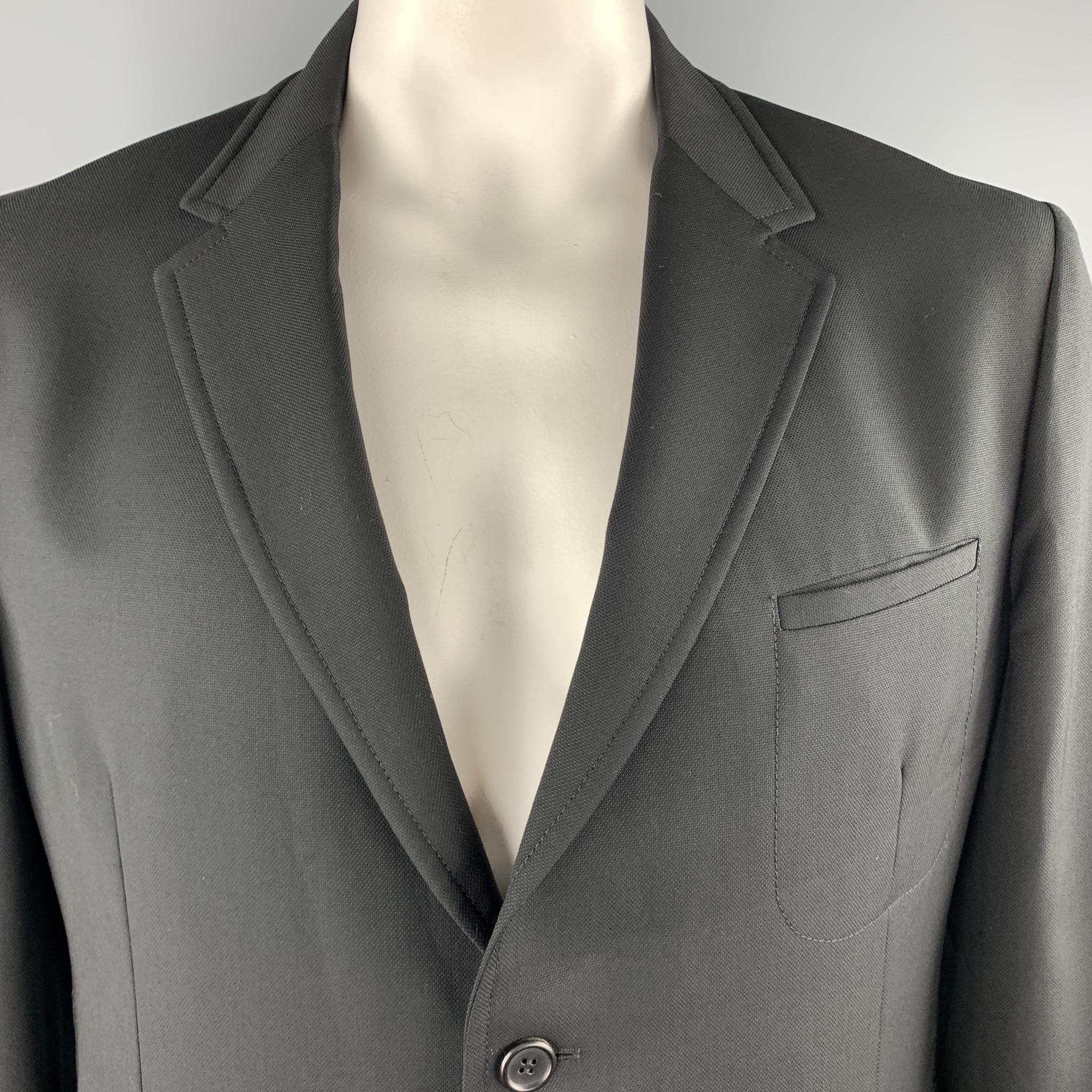 PRADA sport coat comes in woven wool with a notch lapel, single breasted, two button front, and patch pockets. Made in Hungary.

New with Tags. 
Marked: IT 56

Measurements:

Shoulder: 19 in.
Chest: 46 in.
Sleeve: 27 in.
Length: 30 in. 